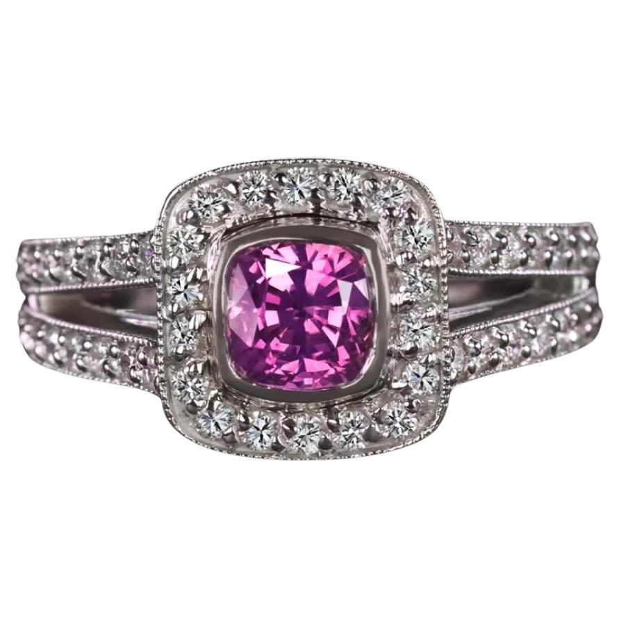 This sapphire and diamond cocktail ring has a very bright pink sapphire surrounded by a halo of round diamonds.

It weights approximately 1.35 carats is a natural sapphire with a bubblegum pink vibrant color.

Also another important fact is that the