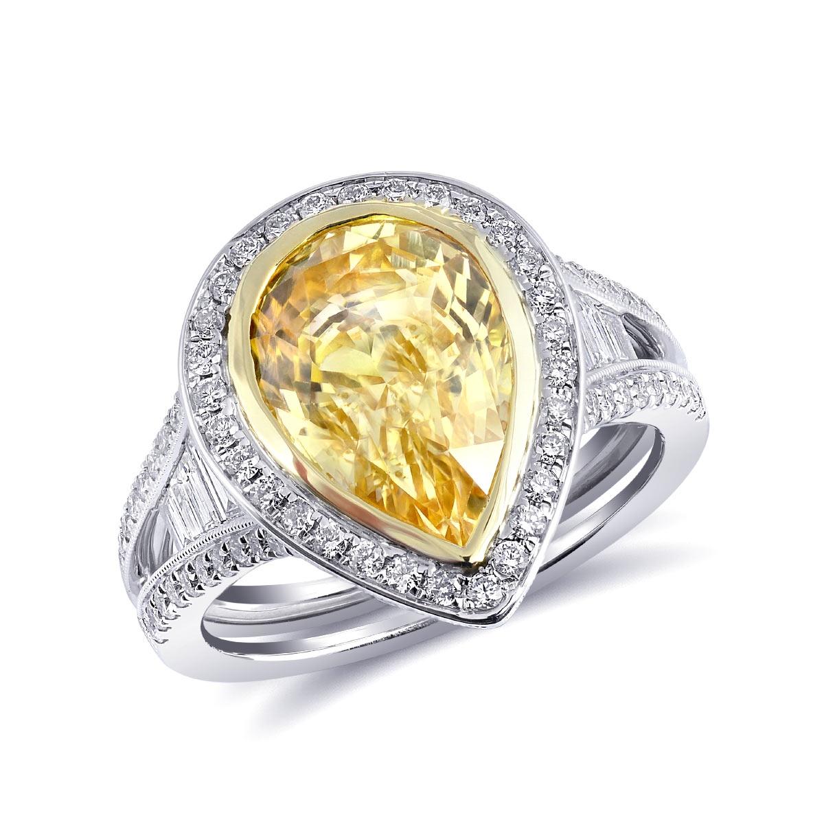Discover the vibrant allure of this exquisite 18K white and yellow gold ring, featuring a stunning natural yellow sapphire accented with sparkling diamonds. The unheated sapphire, with its vivid yellow hue, stands out beautifully against the