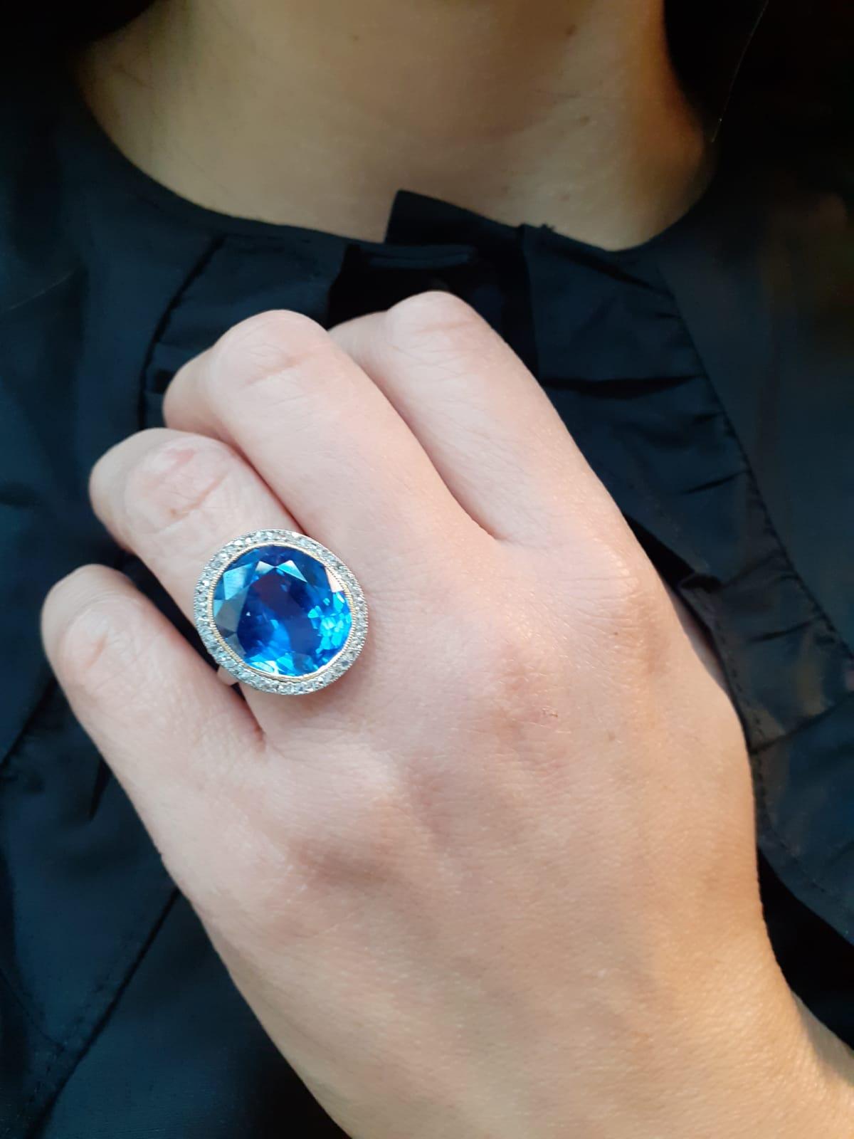 A natural untreated 14.50 carat sapphire diamond ring set in platinum.

This truly stunning ring is set to its centre with an exceptional oval cut sapphire of approximately 14.5 carats, which is securely set into a handmade, intricately designed