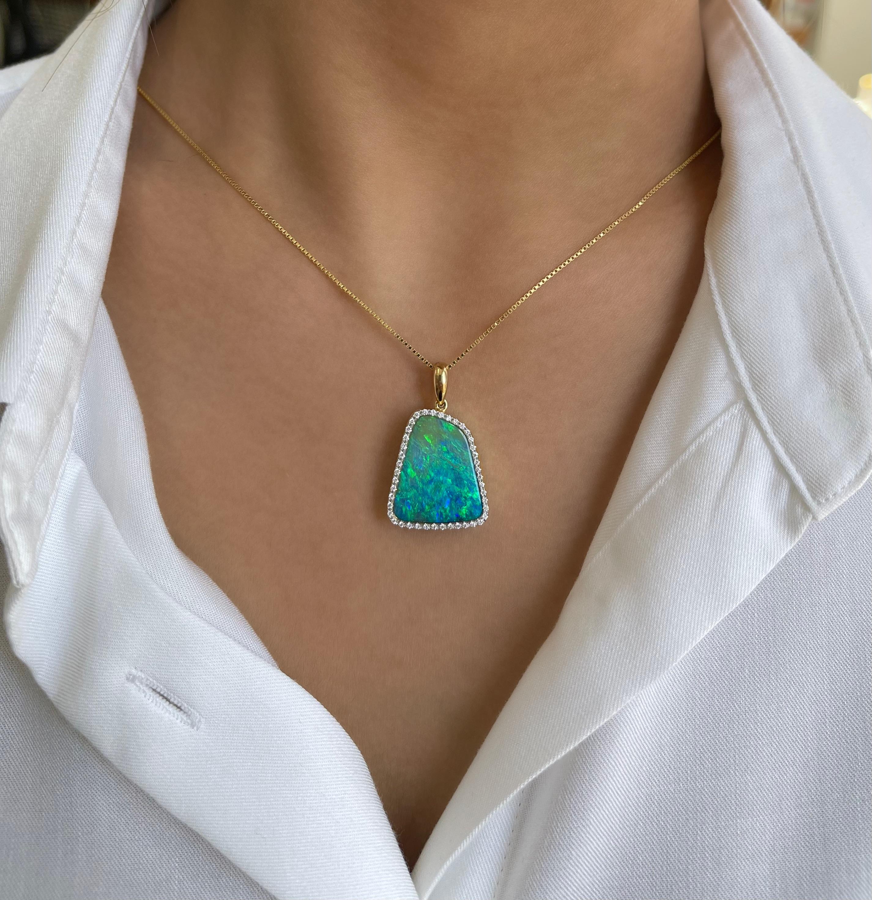 A romantic and glamorous statement piece the ‘Love Walked In’ opal pendant features an electrifying 16.30ct boulder opal hailing from Winton mines in Queensland, Australia. The attractive blue-green play-of-colour in this pendant holds endless