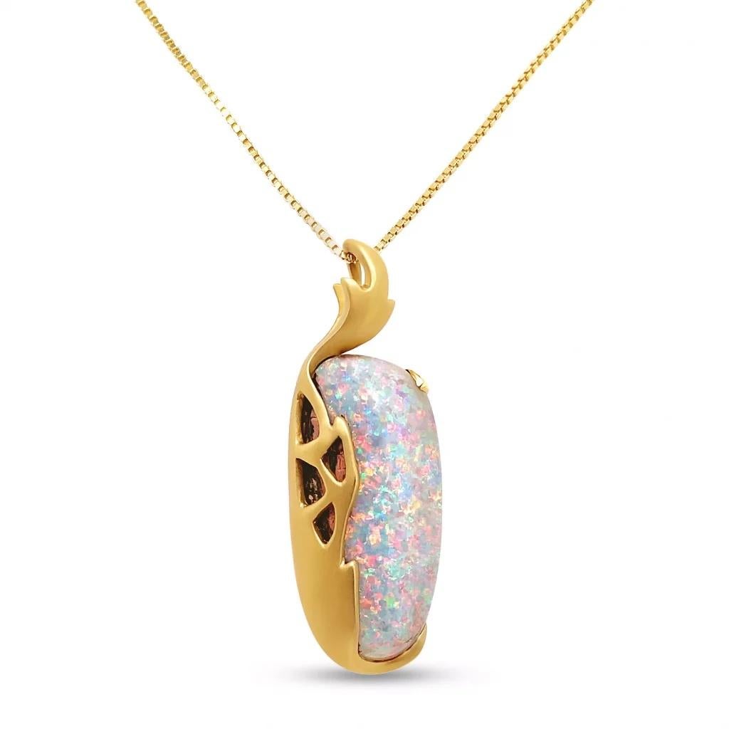 “Cherry Blossom” opal pendant derives its regalities from the sizeable Australian opal (17.62ct) embracing the gem dressed in an 18K yellow gold setting. Natural light boulder opal is ethically sourced from Opal Minded’s own opal mines in