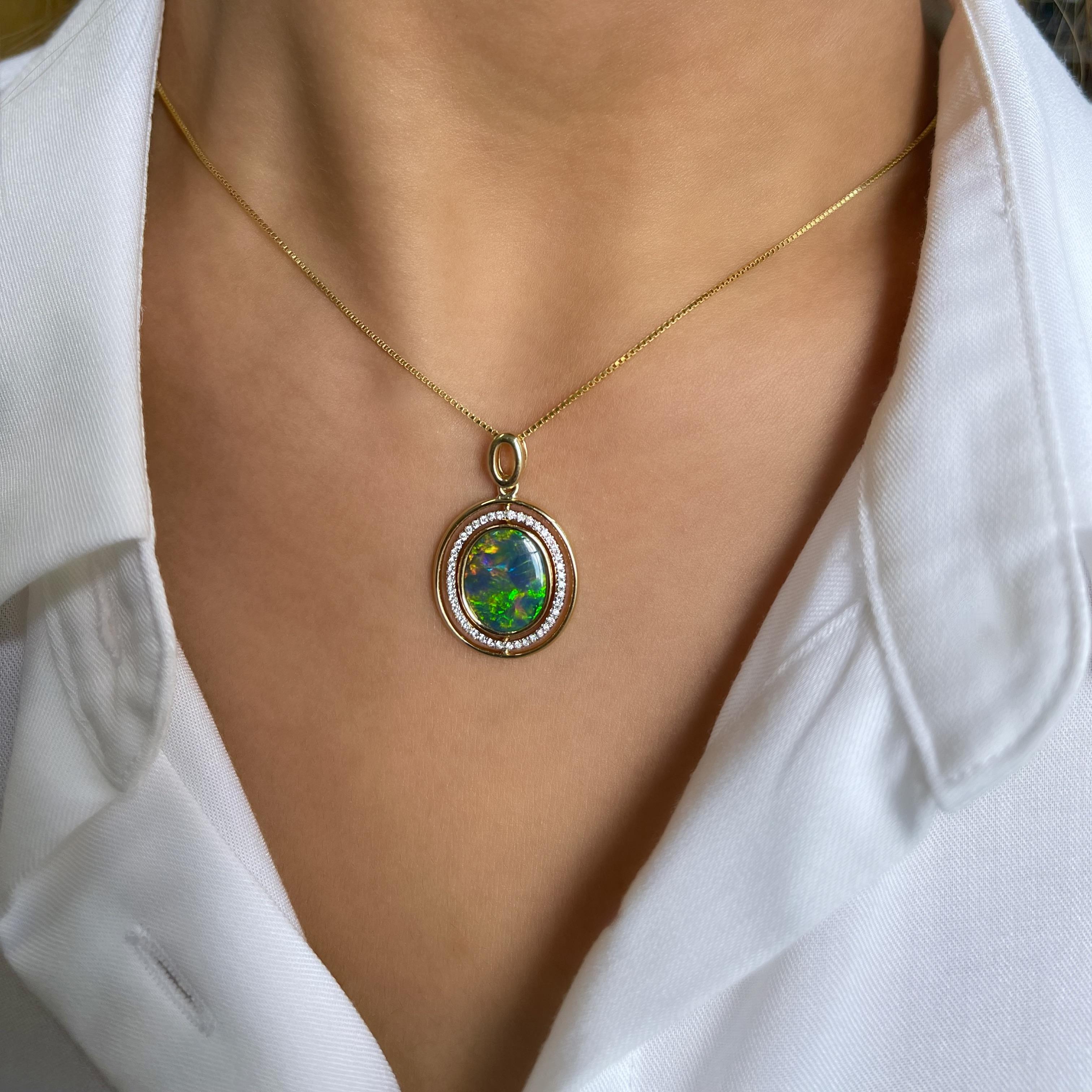 Designed by Renata Bernard, ‘Affection’ opal pendant was inspired by unconditional properties of love. The intense colours of natural boulder opal (2.65ct) are complemented by the inner halo of 42 twinkling diamonds that you can rotate anytime.