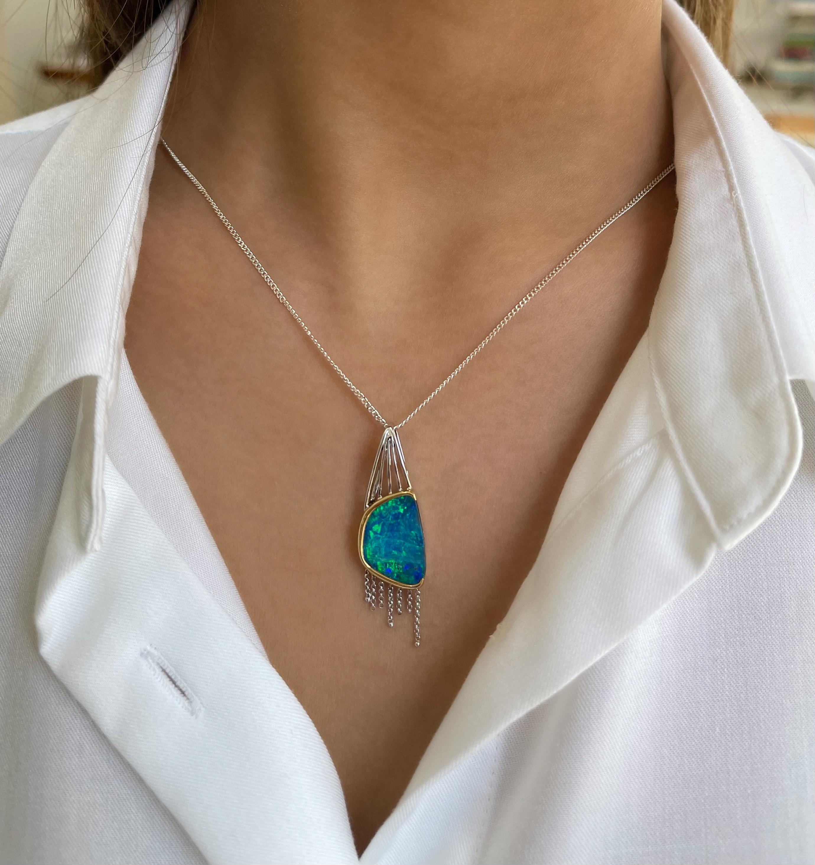 Enticing and elegant, the ‘Waves’ pendant will bring you joy and pleasure with such an electrifying boulder opal (5.19ct). The natural gemstone sourced from Winton mines in Queensland, Australia, is masterfully crafted in classic 18 karats white and