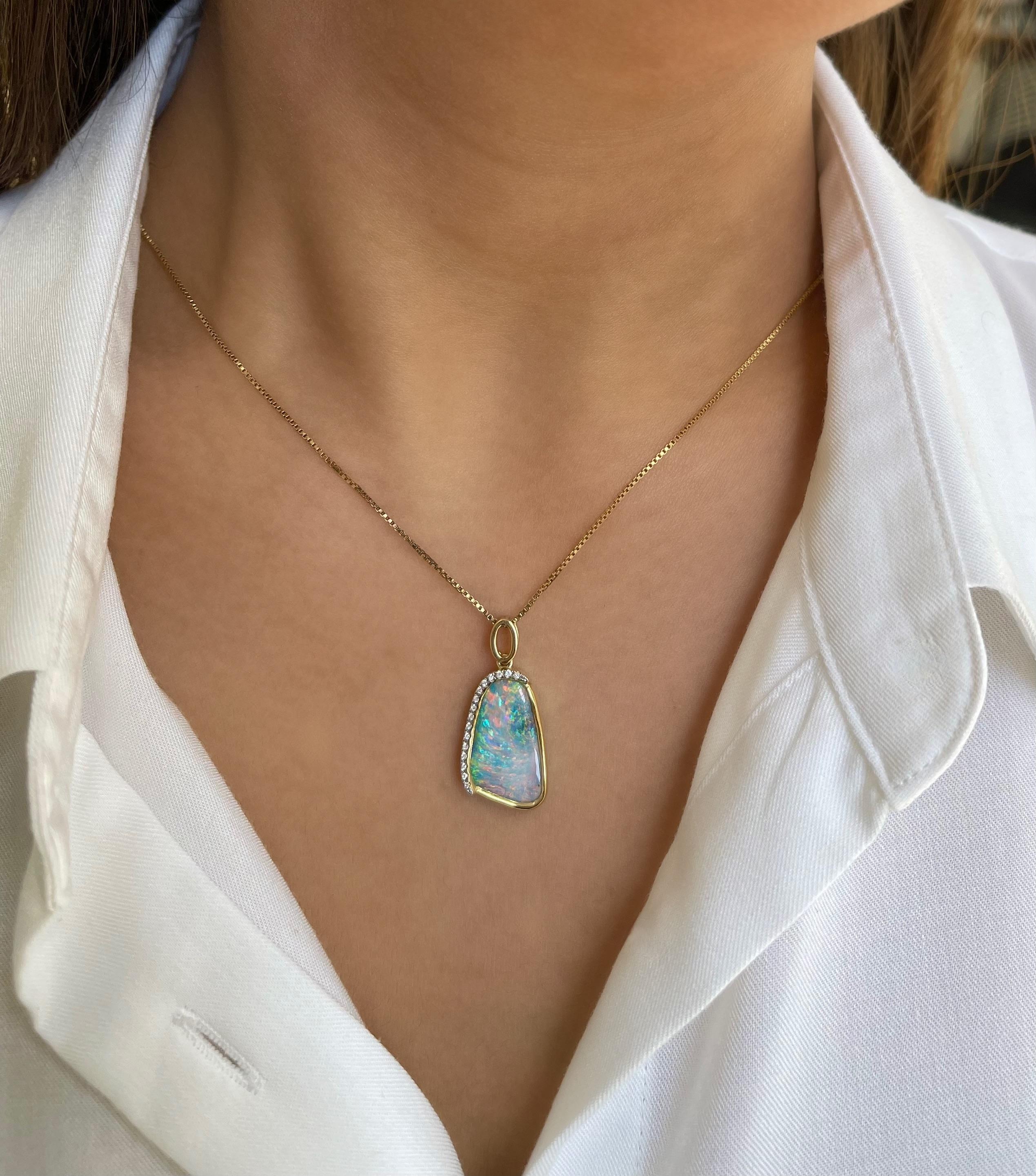 Extremely romantic and glamorous, ‘Madame Butterfly’ opal pendant features an attractive and versatile boulder opal (6.65ct) sourced from Winton mines in Queensland, Australia, bound to turn heads by its sheer beauty. Masterfully crafted in our