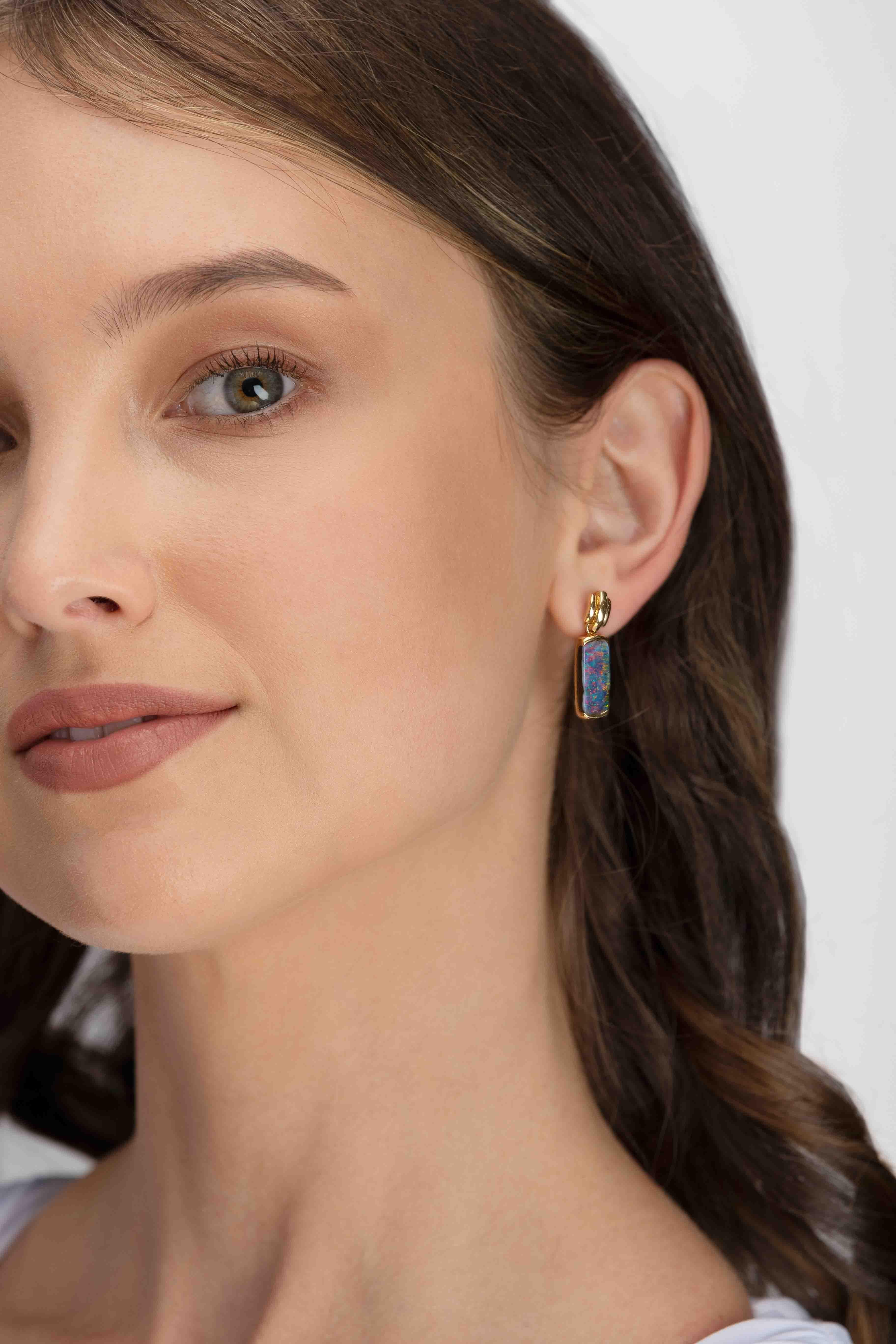 “Waltz of the Flowers” opal earrings present gorgeously colourful Winton boulder opals (8.72ct) that swing, sway, and dance the night away with every movement. An arresting 18K yellow gold setting enhances the mesmerising play-of-colour. Inspired by