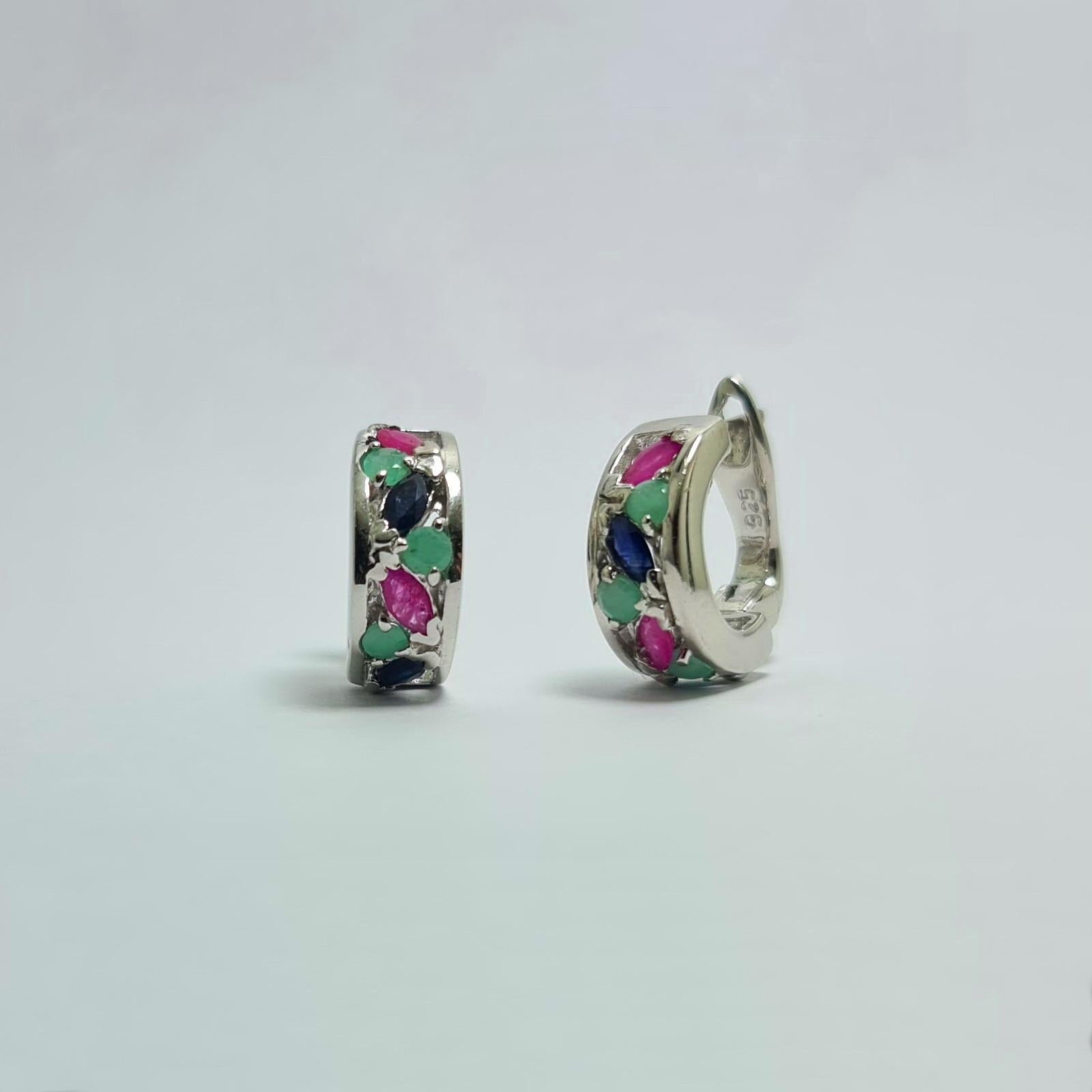Natural Untreated Emerald Sapphire Ruby 
Solid 925 Sterling Silver Rhodium Plated Earrings 

Total weight of the earrings: 8.5 grams
Total weight of the stones: 5 carats