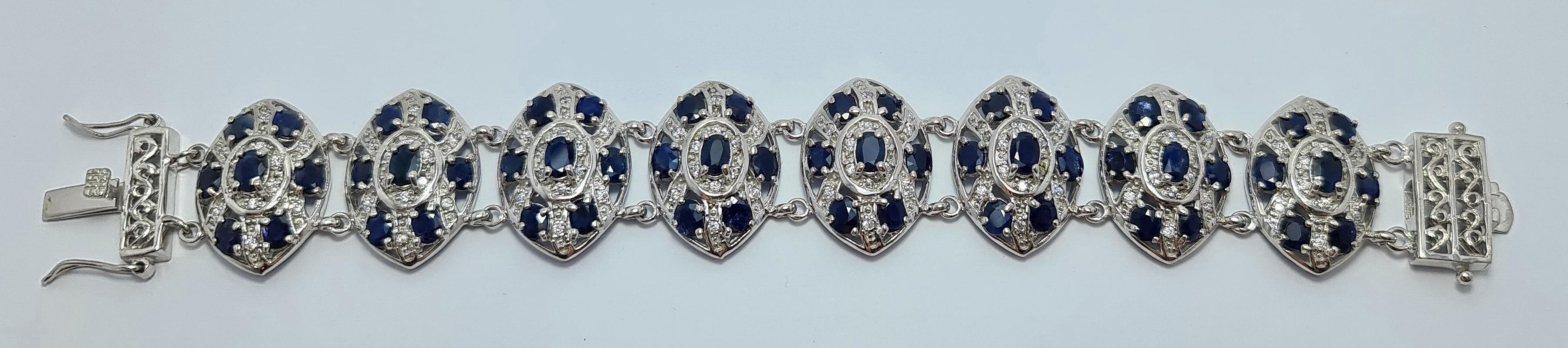 Natural Untreated Thai Kanchanaburi Sapphire Sapphires set in Solid 925 Sterling Silver Rhodium Plated Retro Art Deco Bracelet 

Length - 7.5 inches
Total weight of the bracelet: 50 grams
Total carats weight: 30 carats