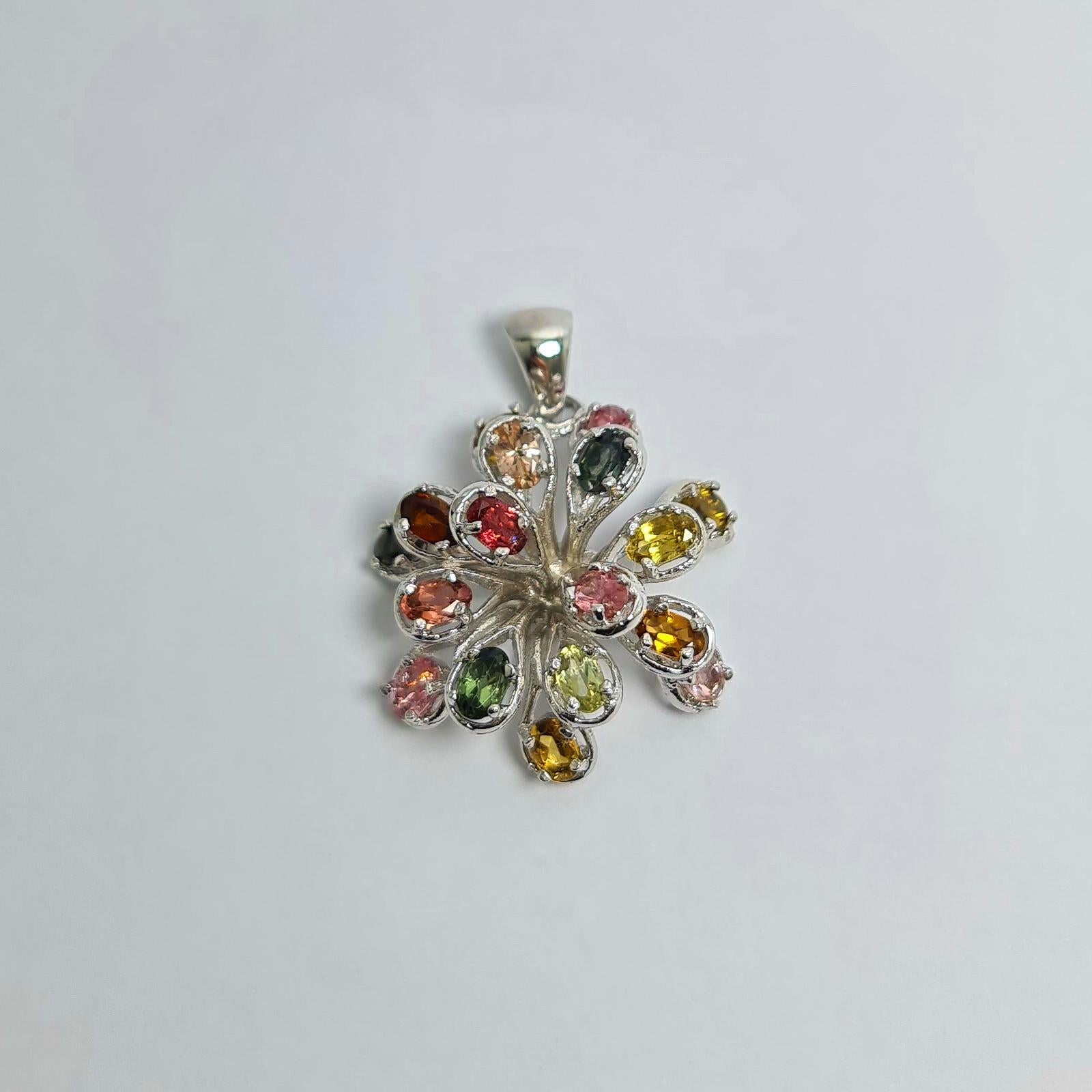 Natural Untreated Brazilian Multi Coloured Tourmaline Firework Burst Pure .925 Sterling Silver Rhodium Plated Pendant 

Total weight of Tourmalines: 7 carats
Total weight if the Pendant: 8.5 grams
