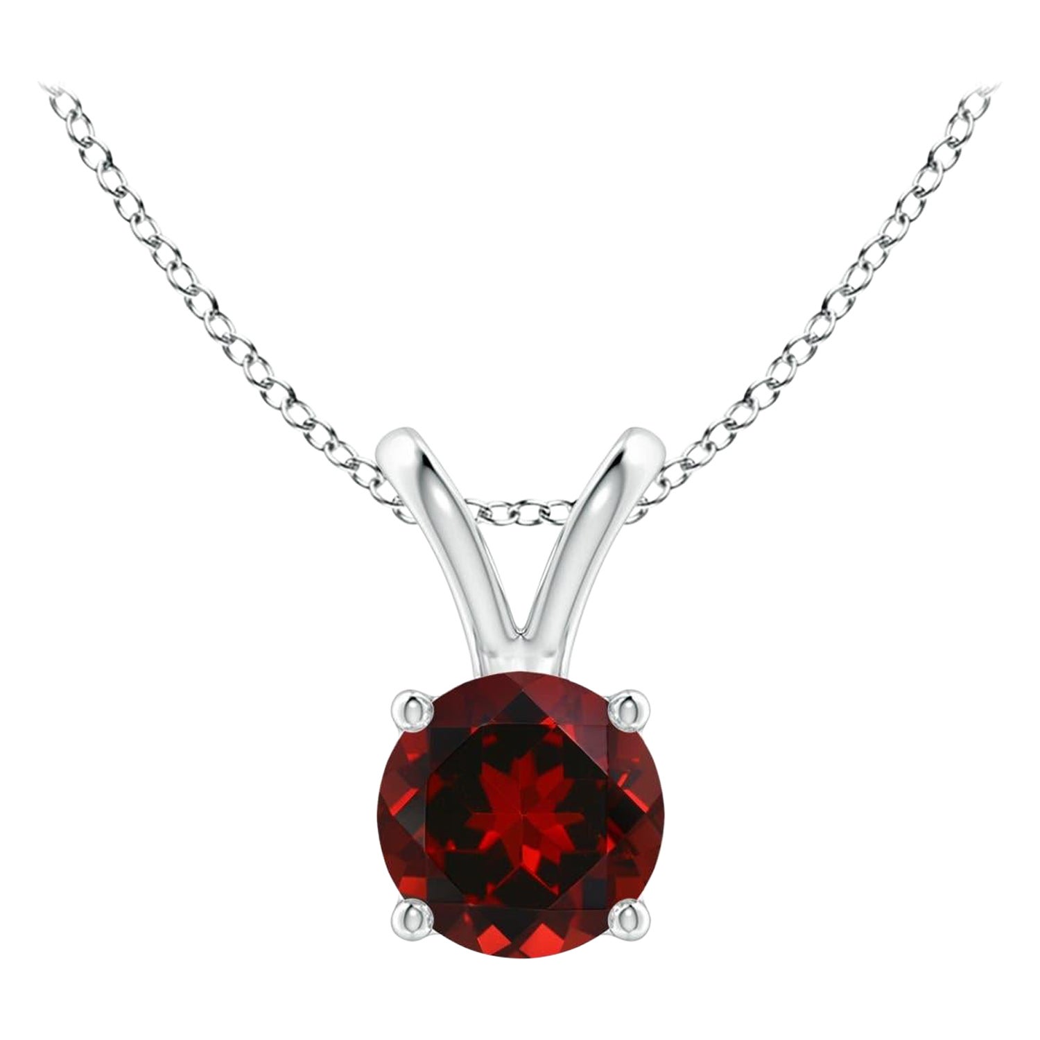Pendentif solitaire rond en platine avec grenat naturel de 0.60 carats