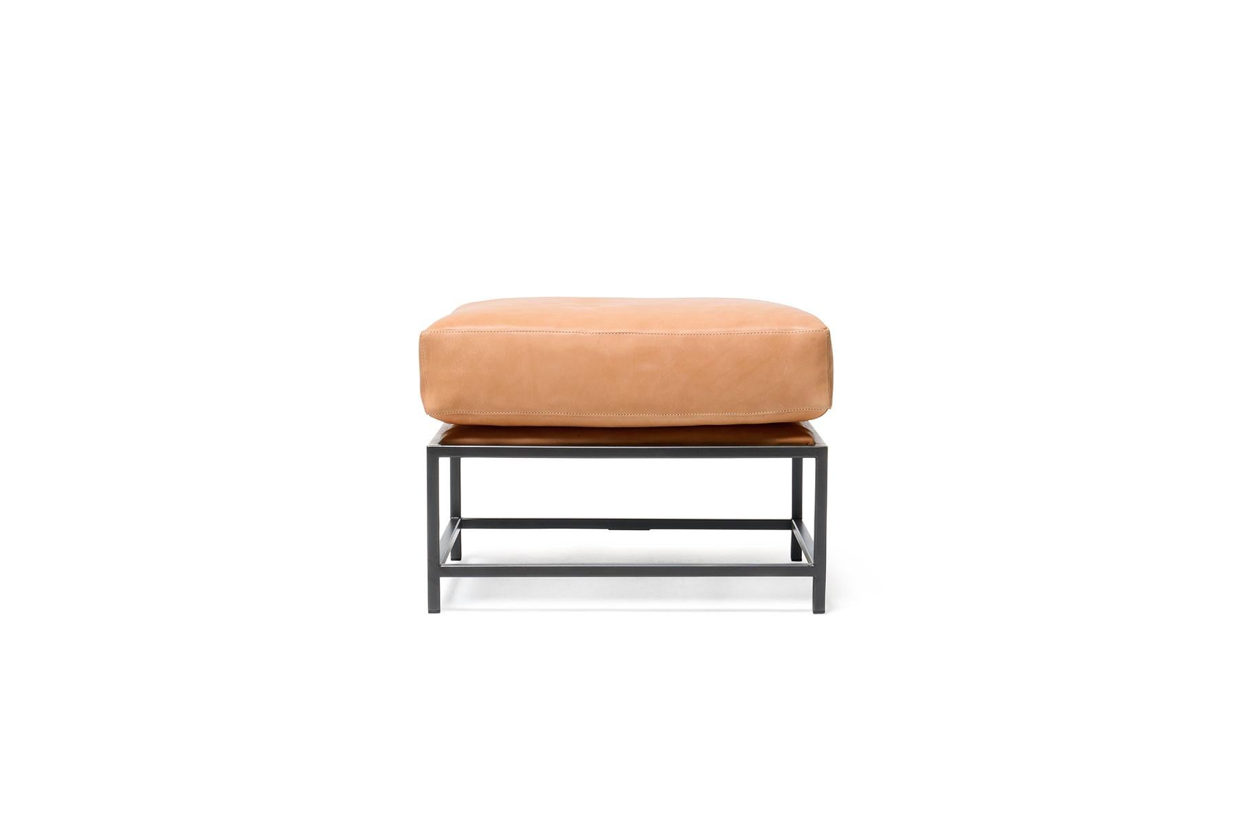 The Inheritance Ottoman by Stephen Kenn is as comfortable as it is unique. The design features an exposed steel frame and a plush upholstered top. This versatile piece can function as seating, a sofa chaise extension, or a footstool and can pair