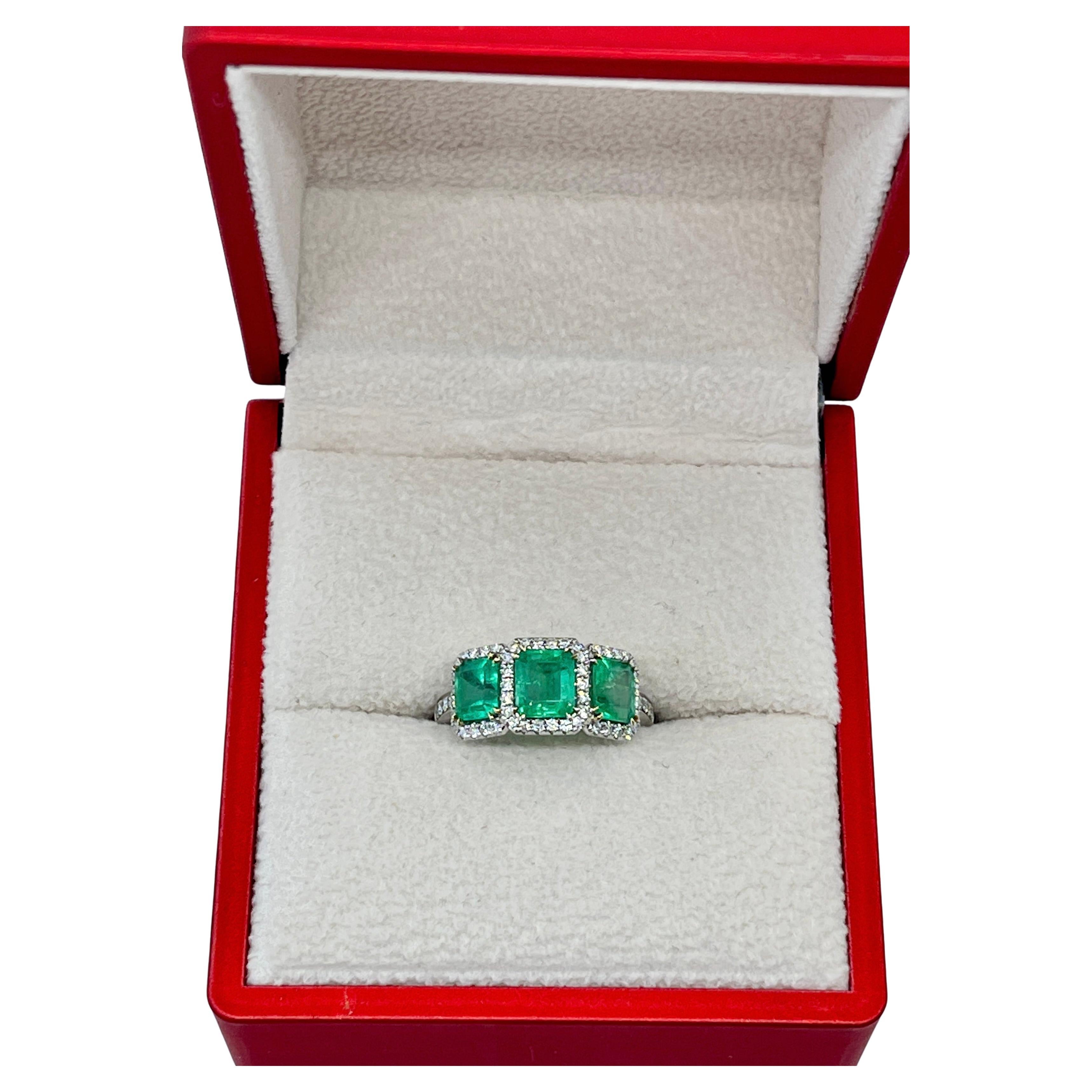 This Magnificent ring features Natural Emeralds Earth Minded from Colombia.

The centrepiece are the 3 x Vivid Green, Natural Colombian Emeralds which together weigh a total of 2.13 carats. Honestly, the photos cannot do this ring justice. The