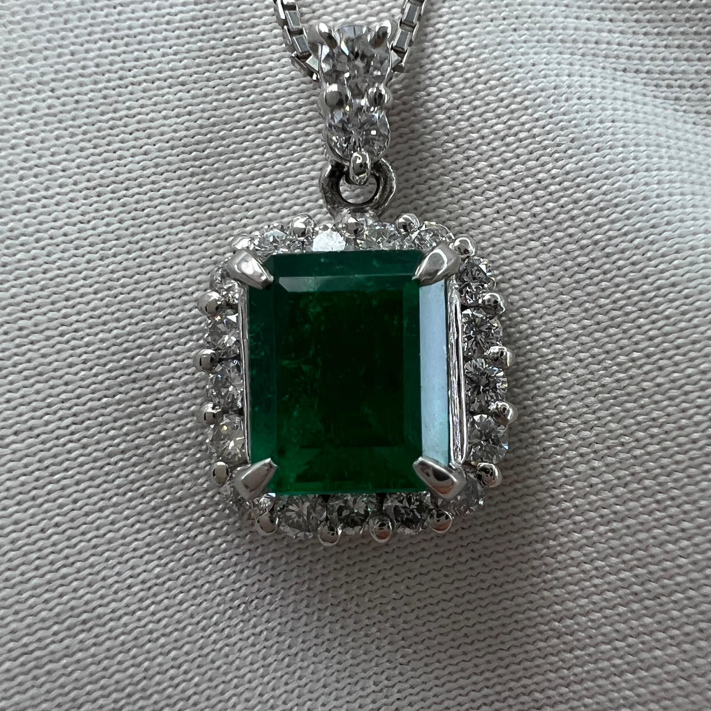 Natural Vivid Green Colombian Emerald & Diamond Platinum Cluster Pendant Necklace.

1.04 Carat Colombian emerald with a fine, vivid intense green colour and very good clarity. Some small natural inclusions visible when looking closely (as expected
