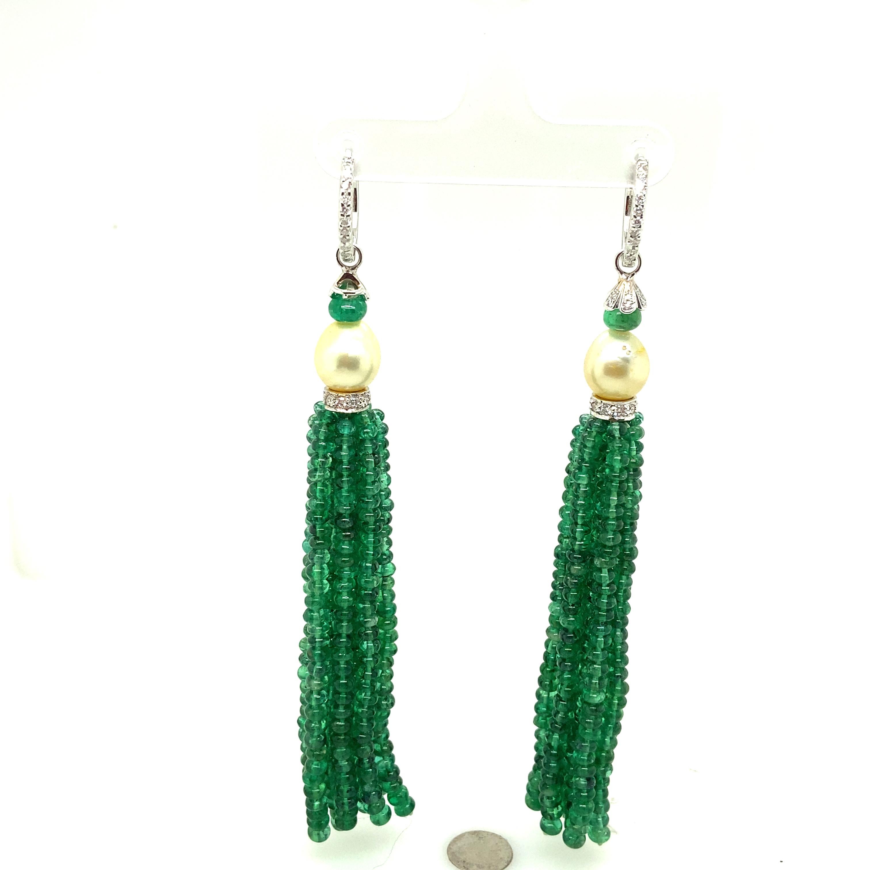 Natural Vivid Green Emerald Beads and Cultured Pearl Tassel Diamond Earrings:

A beautiful pair of earrings, it features natural vivid green emerald beads weighing 106.16 carat assembled as tassels, with a pair of luscious cultured pearls weighing