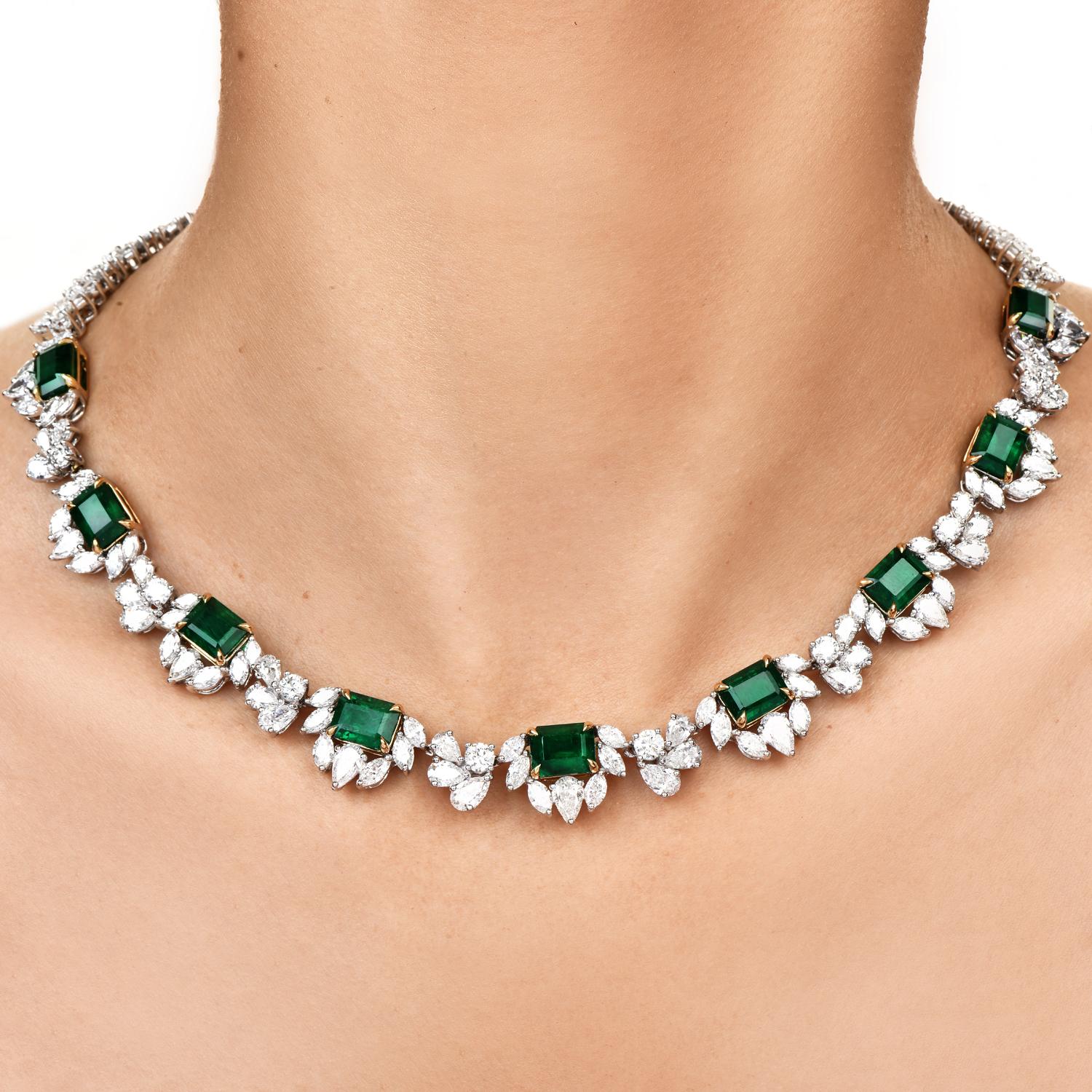 Vintage Diamond & Emerald floral-inspired link eternity necklace,

expertly crafted 18k White gold with yellow gold accents.

Bringing life into the piece are (9) vivid Green genuine fine natural Emerald gemstones, emerald cut, and prong set, 