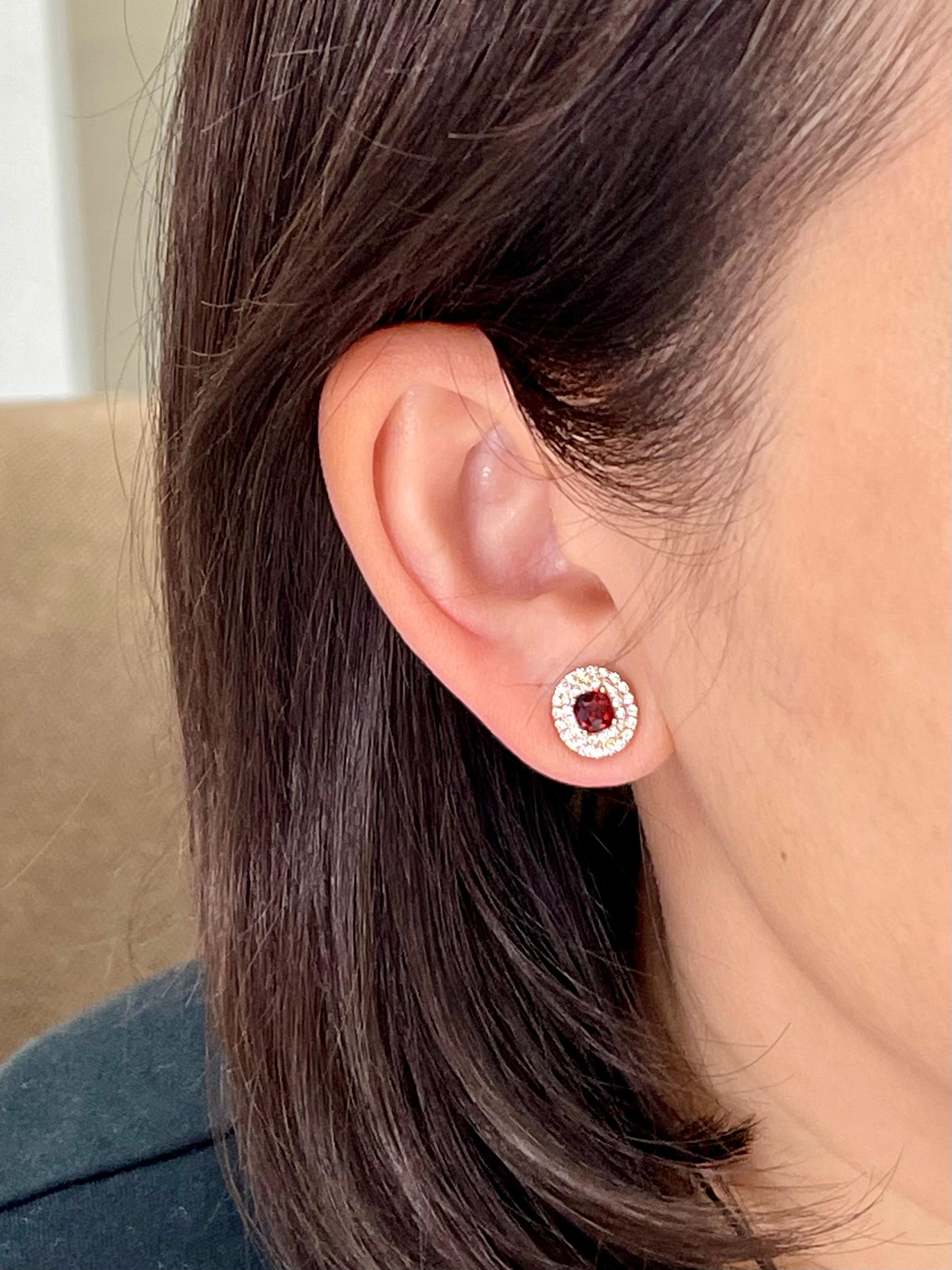 Please check out the HD video. Here is a pair of glowing vivid red spinel stud earrings. The earrings is set in 18k rose gold and diamonds. There are 0.49Cts of round brilliant full cut diamonds in this double halo setting. The two vivid spinels
