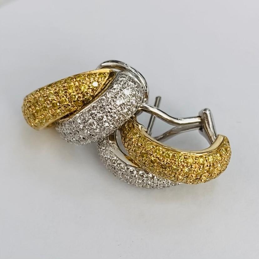 18K Yellow and White Gold earrings
1.74 cts total diamonds
White diamonds = 0.82 cts 
Yellow diamonds = 0.92 cts 
9.360 gms 18k
