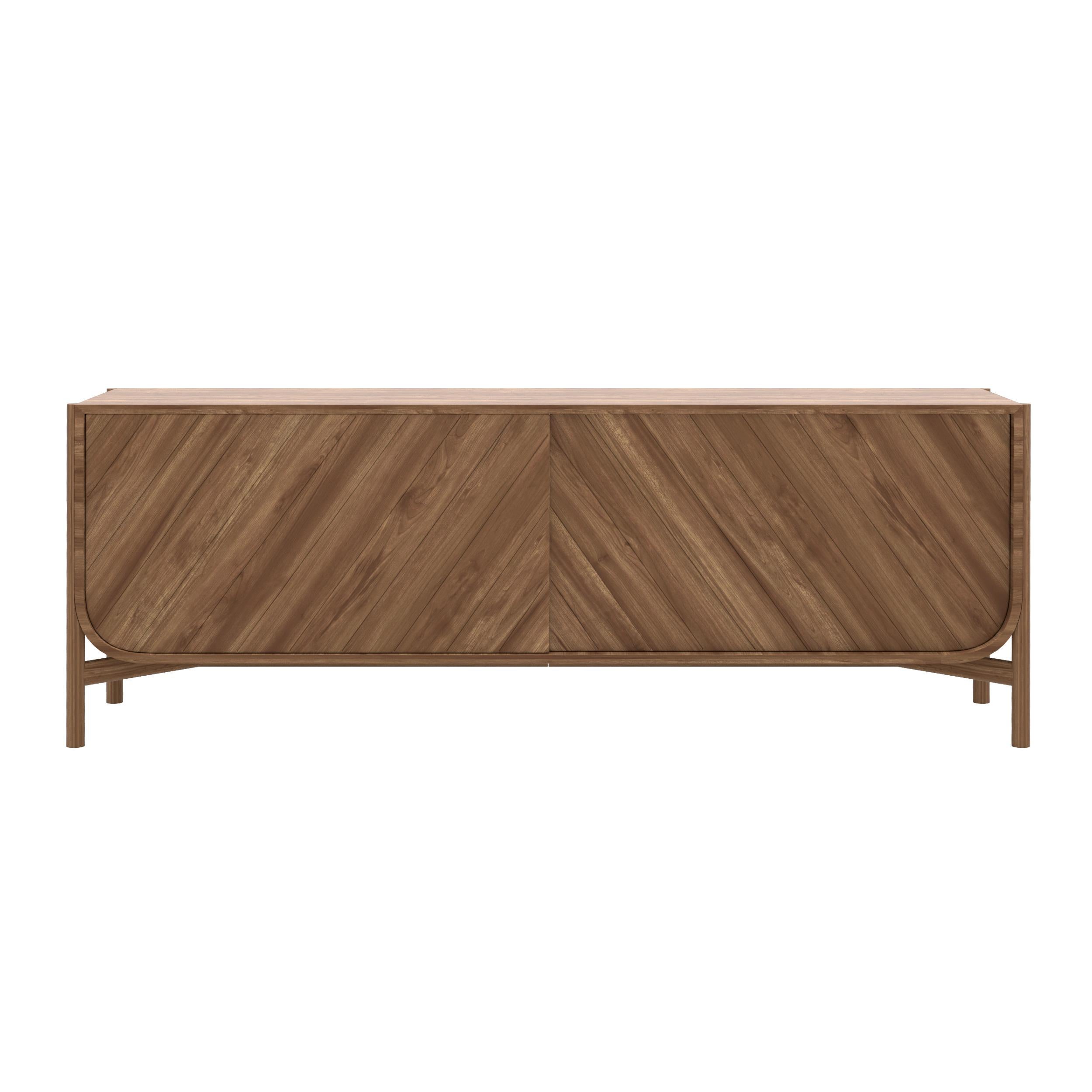 Natural Walnut Marius Sideboard 185 by HARTO
Dimensions: W 185 x D 45 x H 65 cm. 
Materials: Solid Wood, MDF wood veneer.  
Weight: 59.0 kg

The 185cm sideboard from the Marius collection is undeniably elegant, with its sliding doors engraved with