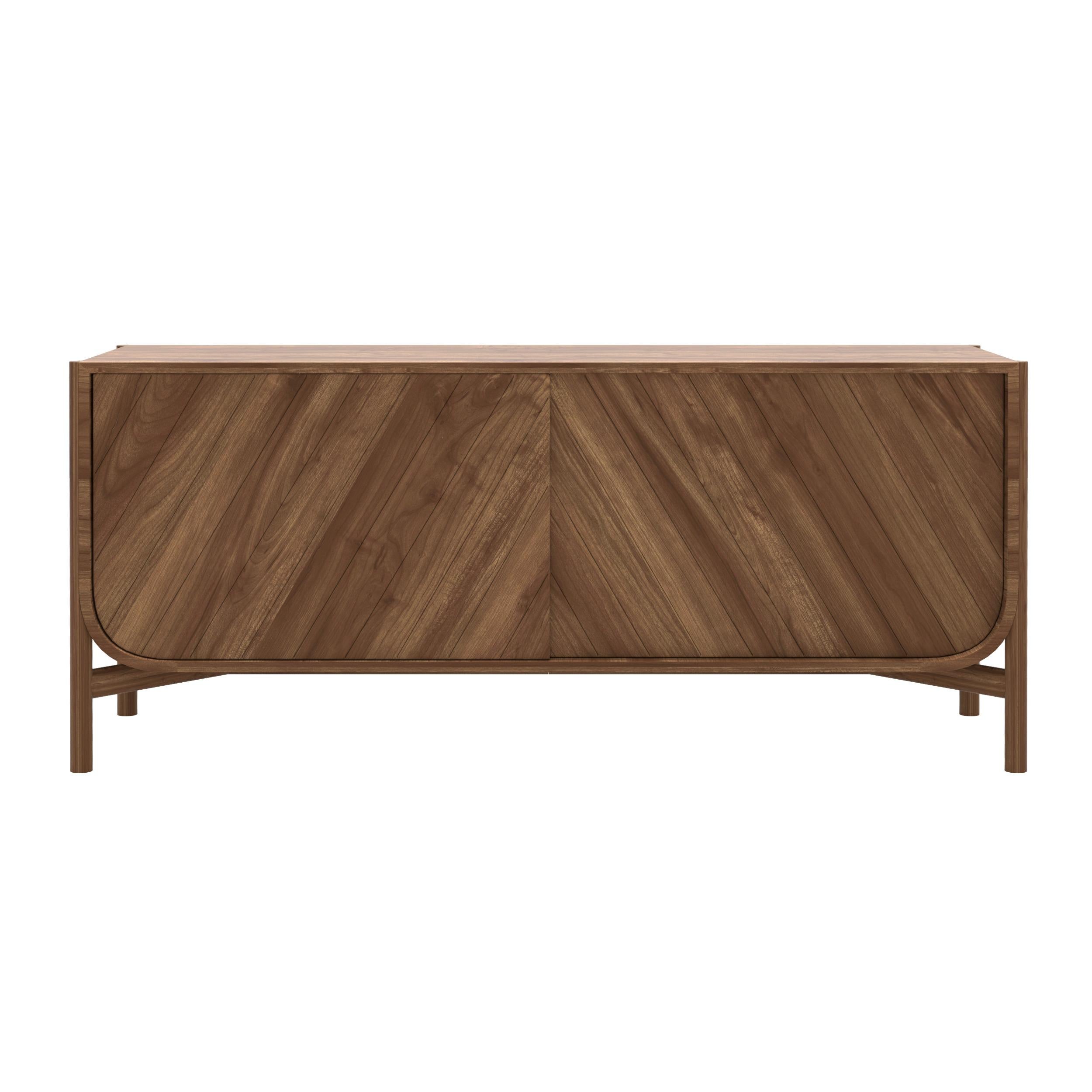 Natural Walnut Marius Sideboard by HARTO
Dimensions: W 155 x D 45 x H 65 cm. 
Materials: Solid Wood, MDF wood veneer.  
Weight: 51.0 kg

The 155cm sideboard from the Marius collection is undeniably elegant, with its sliding doors engraved with