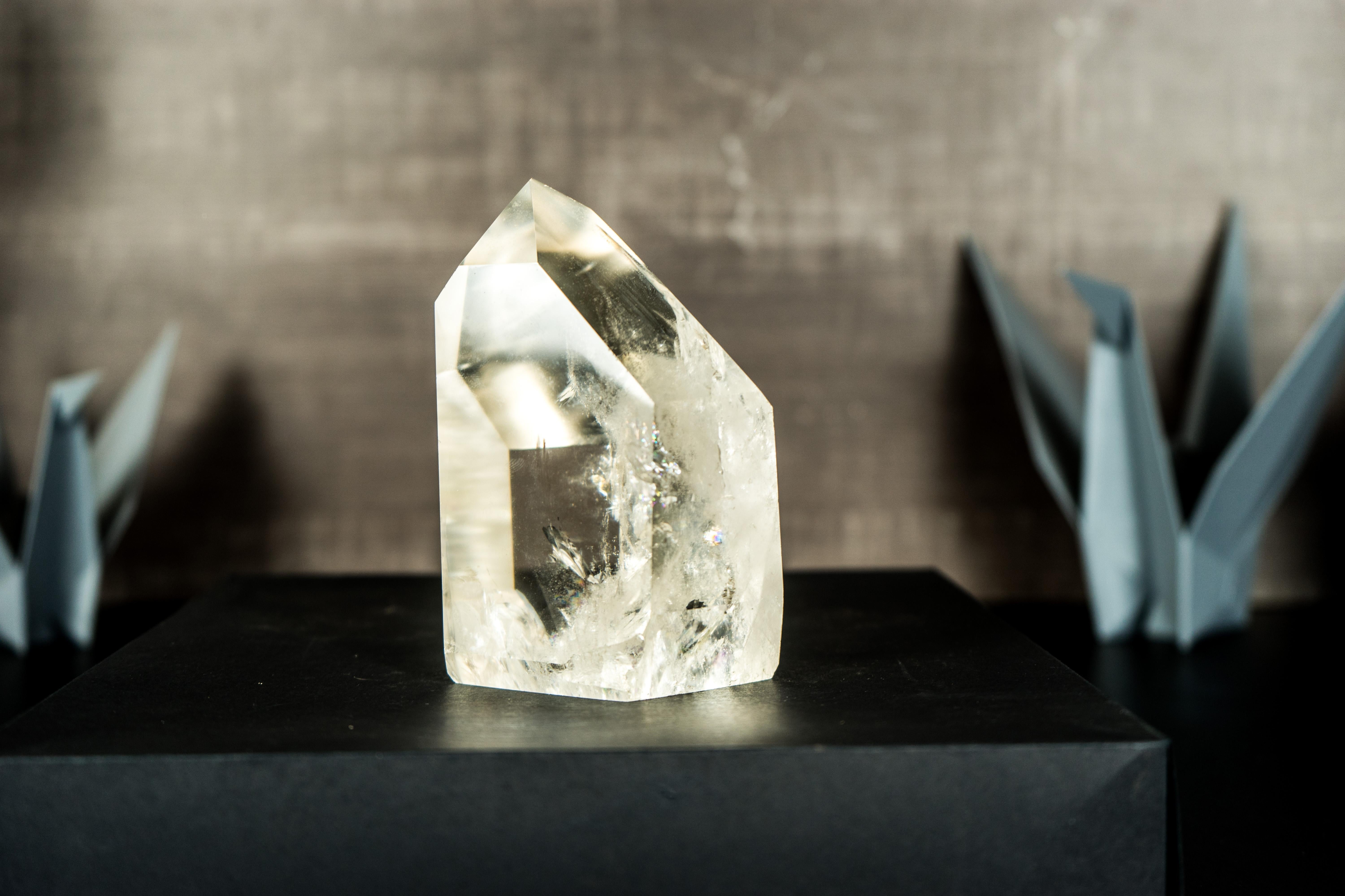 Showcasing stunning aesthetics, this Clear Quartz Obelisk point features unparalleled water-clear transparency and highly skilled craftsmanship, making it a masterpiece of natural artistry. It is an AAA Crystal Point from Diamantina that not only