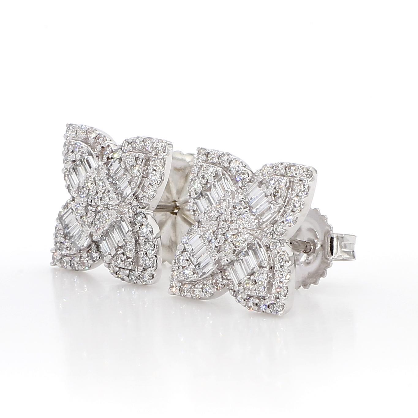 RareGemWorld's classic diamond earrings. Mounted in a beautiful 18K Yellow and White Gold setting with natural baguette cut white diamonds and natural round white diamond melee. These earrings are guaranteed to impress and enhance your personal