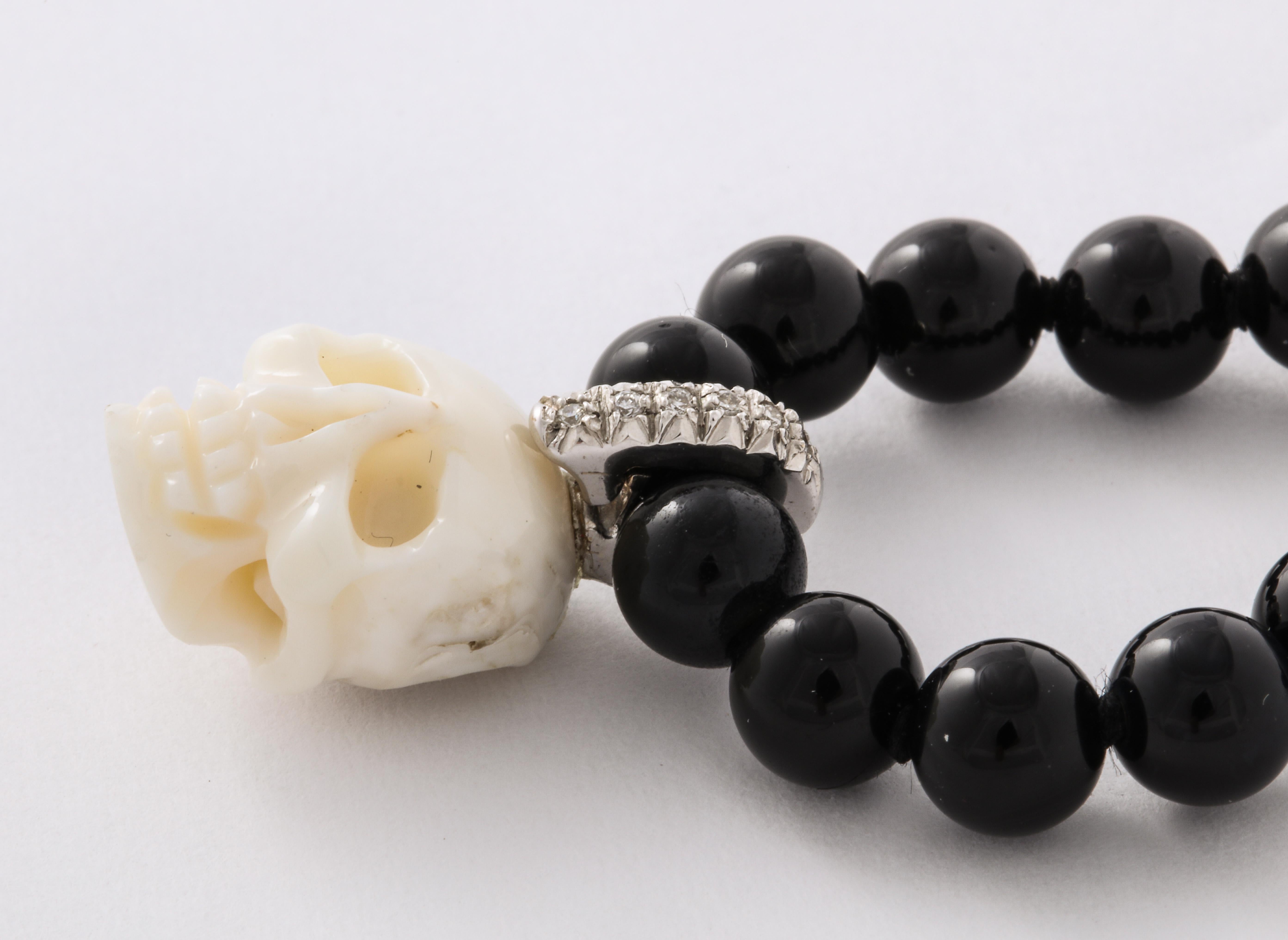 Natural White Coral Carved Skull Paved Diamonds On Onyx Beads 18k Gold Clasp In New Condition For Sale In New York, NY