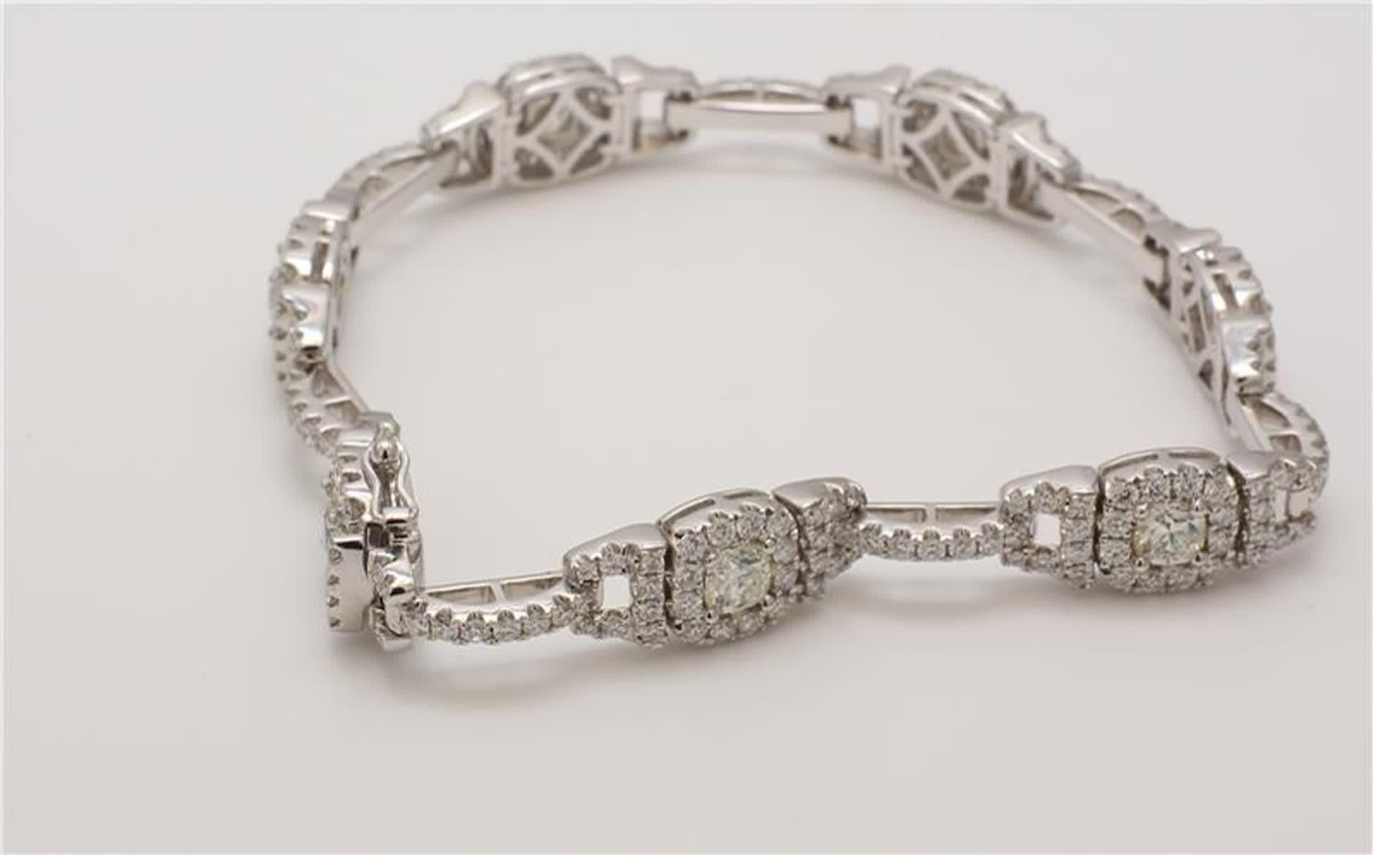 Rare cushion white diamonds surrounded by round white diamonds This bracelet is designed to be placed in a simple but intriguing setting. Can be used as a tennis bracelet or in addition to your collection of jewels.

Total Weight: