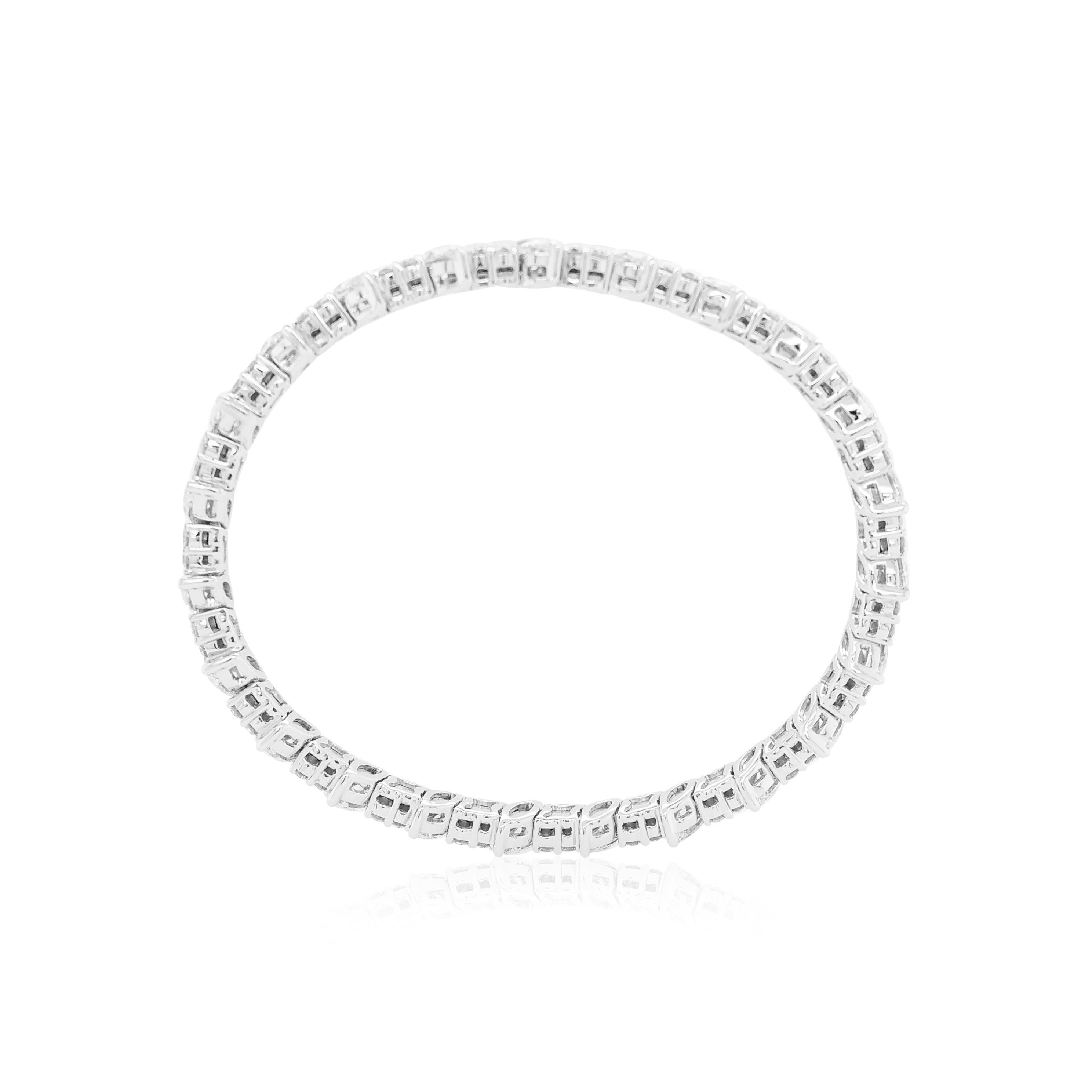 This playful bangle features sumptuous Marquise-shape and Round-shape White Diamonds setting among 18K white gold. With a hidden clasp, easy to wear, day or night, this unique bangle is sure to set you apart from the crowd. This contemporary bangle