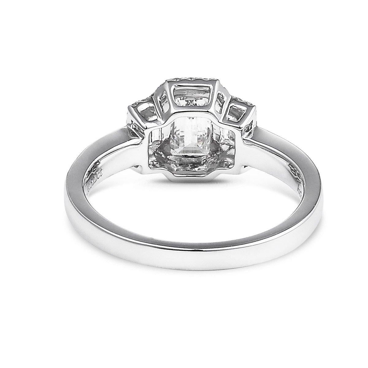 This unique ring is made up of 100% natural untreated white diamonds. The main center stone is 0.63 Carats G-F VS. The perfect solution for an elegant engagement ring. This piece has been expertly crafted using 18K White Gold. 

This piece can be