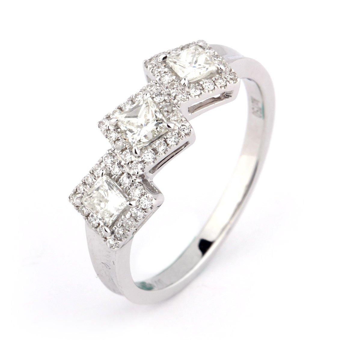 This Beautiful piece consists of three main princess shape diamonds, surrounded by smaller natural white diamonds. Making up a total of 0.60 Carats. Expertly crafted using 18 Karat White gold. Contemporary style, perfect for everyday wear or