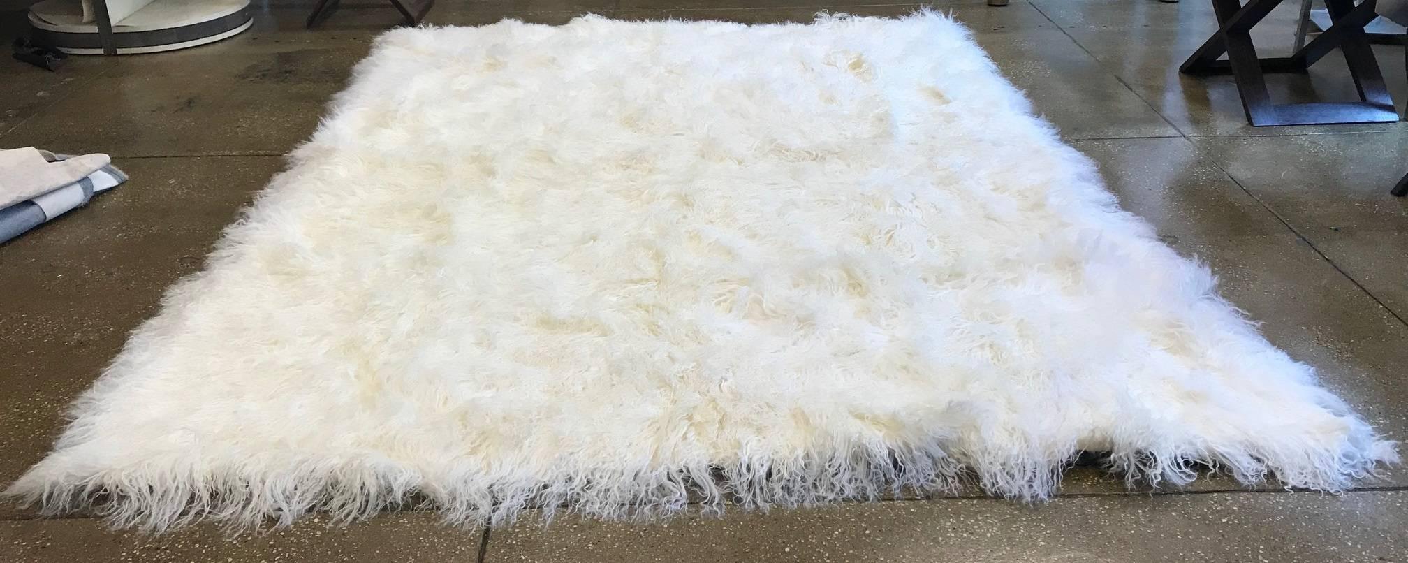 New bleached white Mongolian lamb rug
Size: 6' x 8'
Lined with black padded cotton fabric.
 