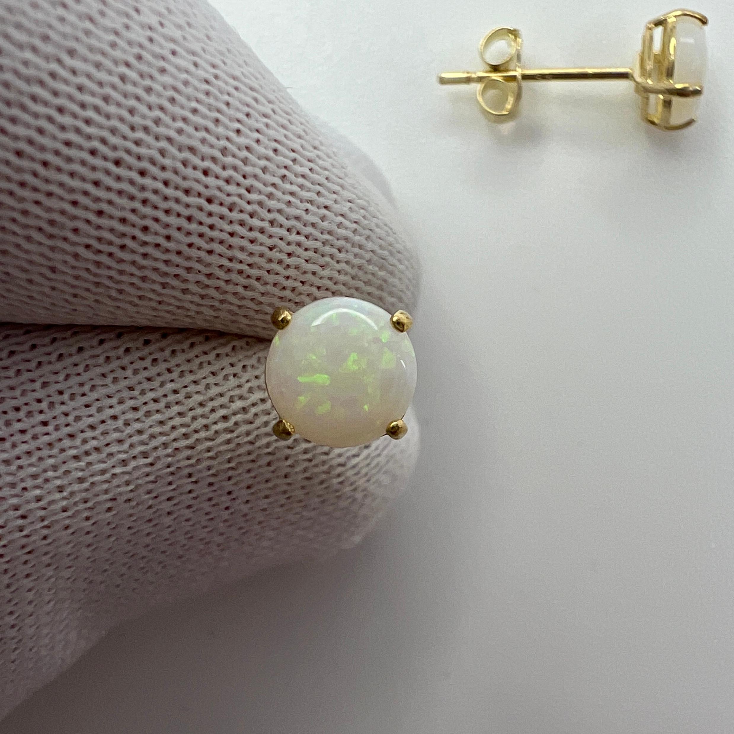 Natural White Opal Yellow Gold Stud Earrings.

Beautiful 5mm matching pair of opals with excellent colour, clarity and round cabochon cut.

The gemstones may vary slightly from the images as these studs are made to order and selected from a parcel