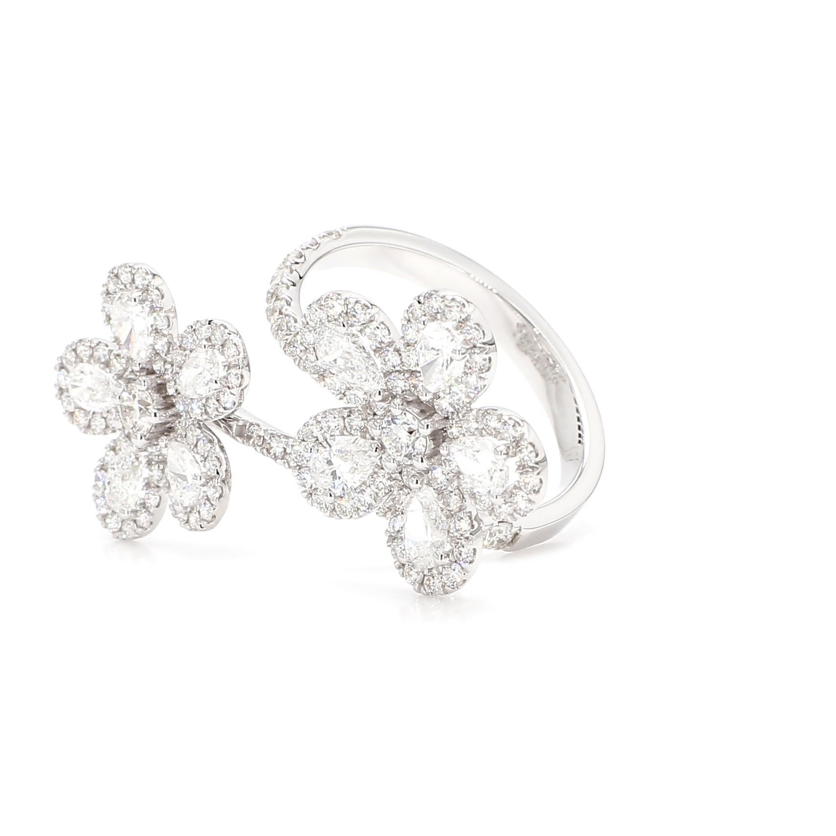 RareGemWorld's beautiful diamond ring. Mounted in a beautiful 18K White Gold setting with natural pear cut white diamonds complimented by round natural white diamond melee. This ring is guaranteed to impress and enhance your personal
