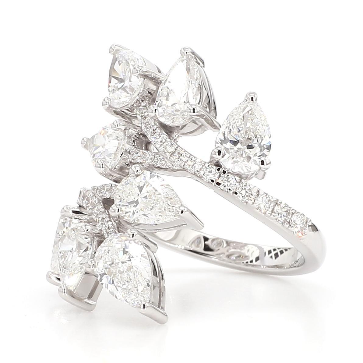 RareGemWorld's intriguing diamond ring. Mounted in a beautiful 18K White Gold setting with natural pear cut white diamonds complimented by round natural white diamond melee. This ring is guaranteed to impress and enhance your personal