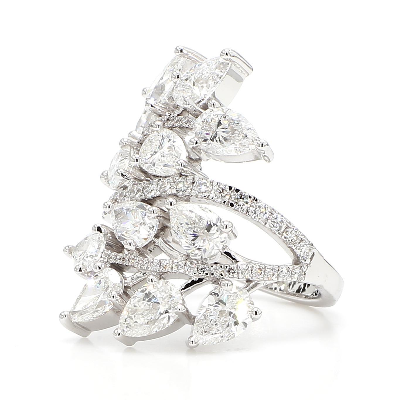 RareGemWorld's beautiful diamond ring. Mounted in a beautiful 18K White Gold setting with natural pear cut white diamonds complimented by round natural white diamond melee. This ring is guaranteed to impress and enhance your personal