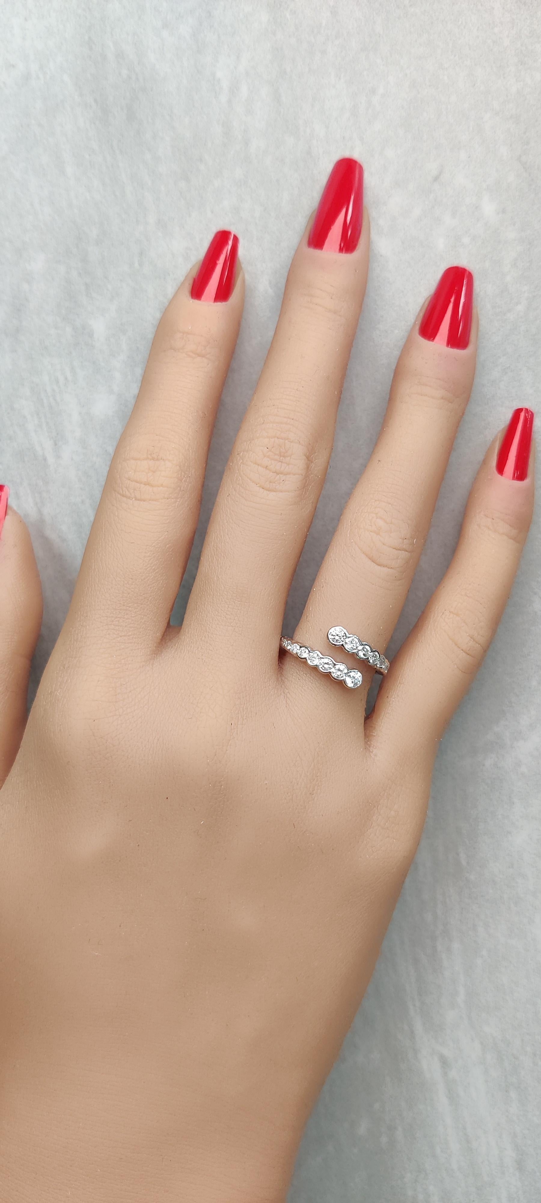 RareGemWorld's classic diamond band. Mounted in a beautiful 18K White Gold setting with natural round white diamond melee. This band is guaranteed to impress and enhance your personal collection!

Total Weight: 0.78cts

Natural Round White Diamonds