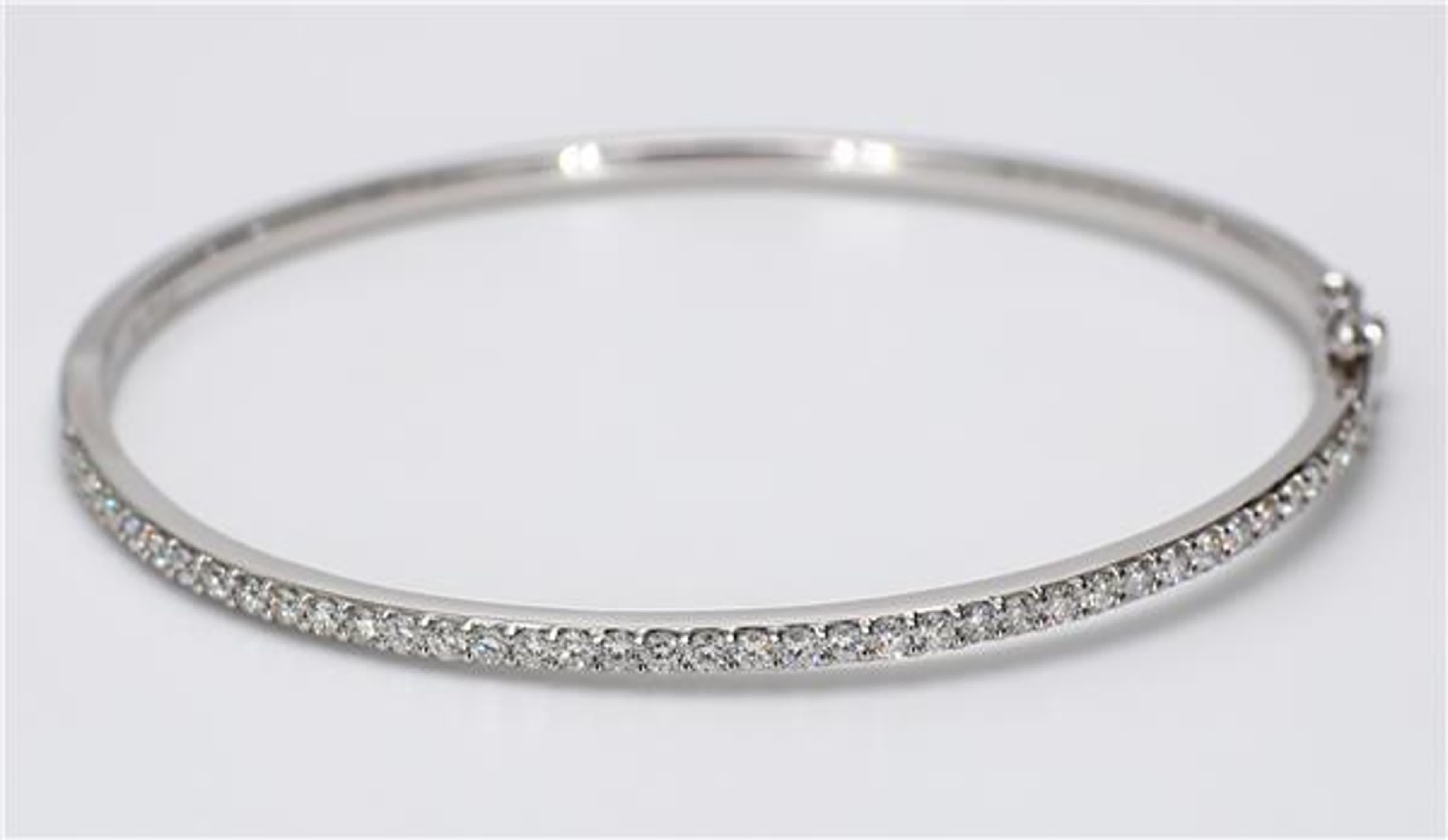 RareGemWorld's classic diamond bracelet. Mounted in a beautiful 18K White Gold setting with round natural white diamond melee. This bracelet is guaranteed to impress and enhance your personal collection.

Total Weight: 1.06cts

Diamond Measurements: