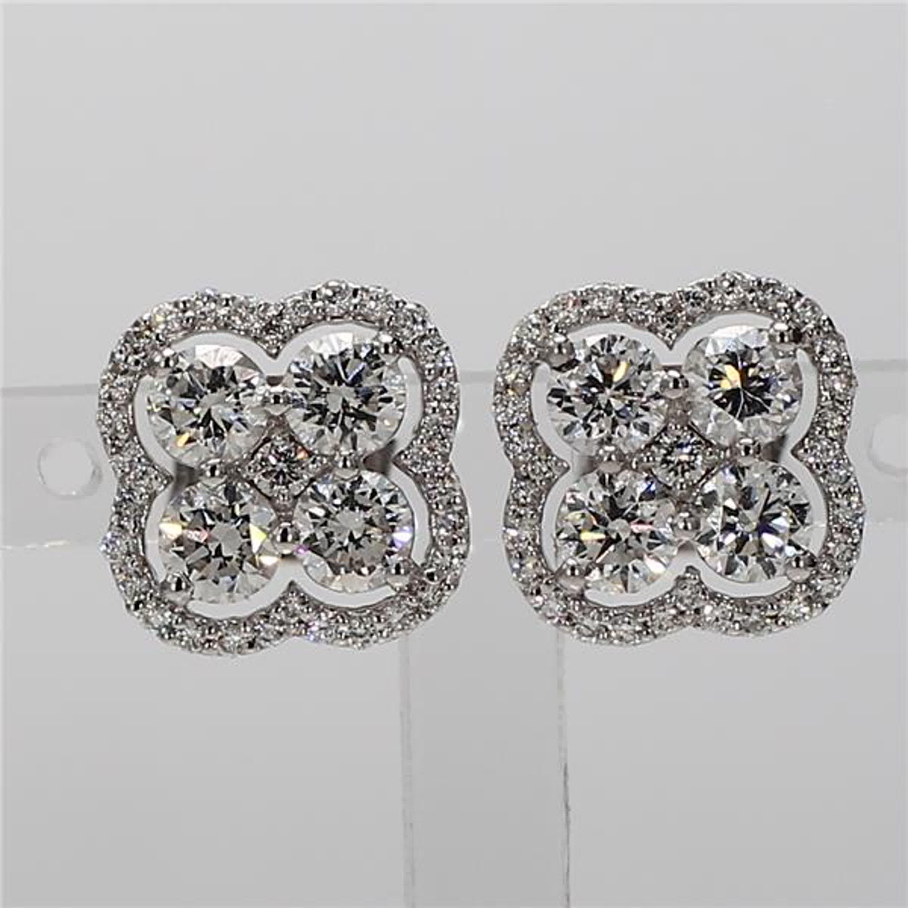 RareGemWorld's classic diamond earrings. Mounted in a beautiful 18K White Gold setting with big natural round cut white diamonds surrounded by small natural round white diamond melee. These earrings are guaranteed to impress and enhance your