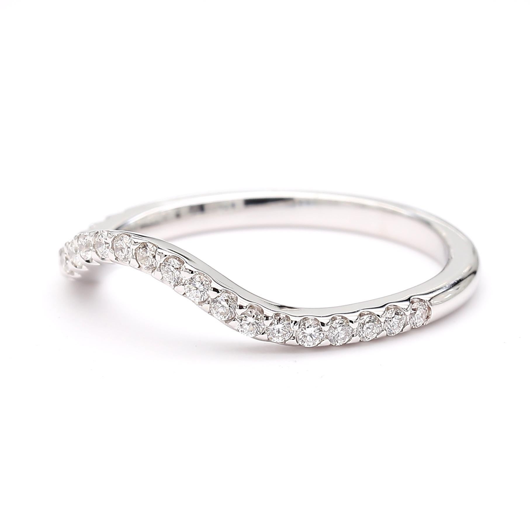RareGemWorld's classic diamond band. Mounted in a beautiful 14K White Gold setting with natural round white diamond melee. This band is guaranteed to impress and enhance your personal collection!

Total Weight: .24cts

Natural Round White