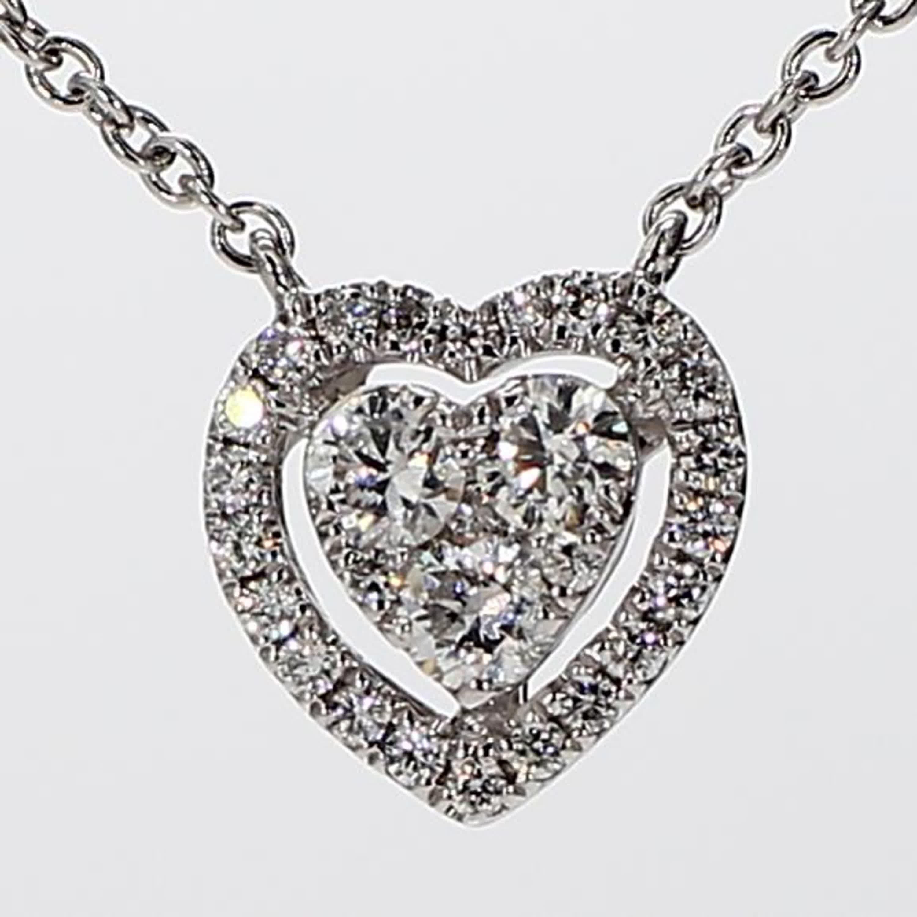 RareGemWorld's classic diamond pendant. Mounted in a beautiful 18K White Gold setting with natural round white diamond melee in a beautiful heart-shape. This pendant is guaranteed to impress and enhance your personal collection.

Total Weight: