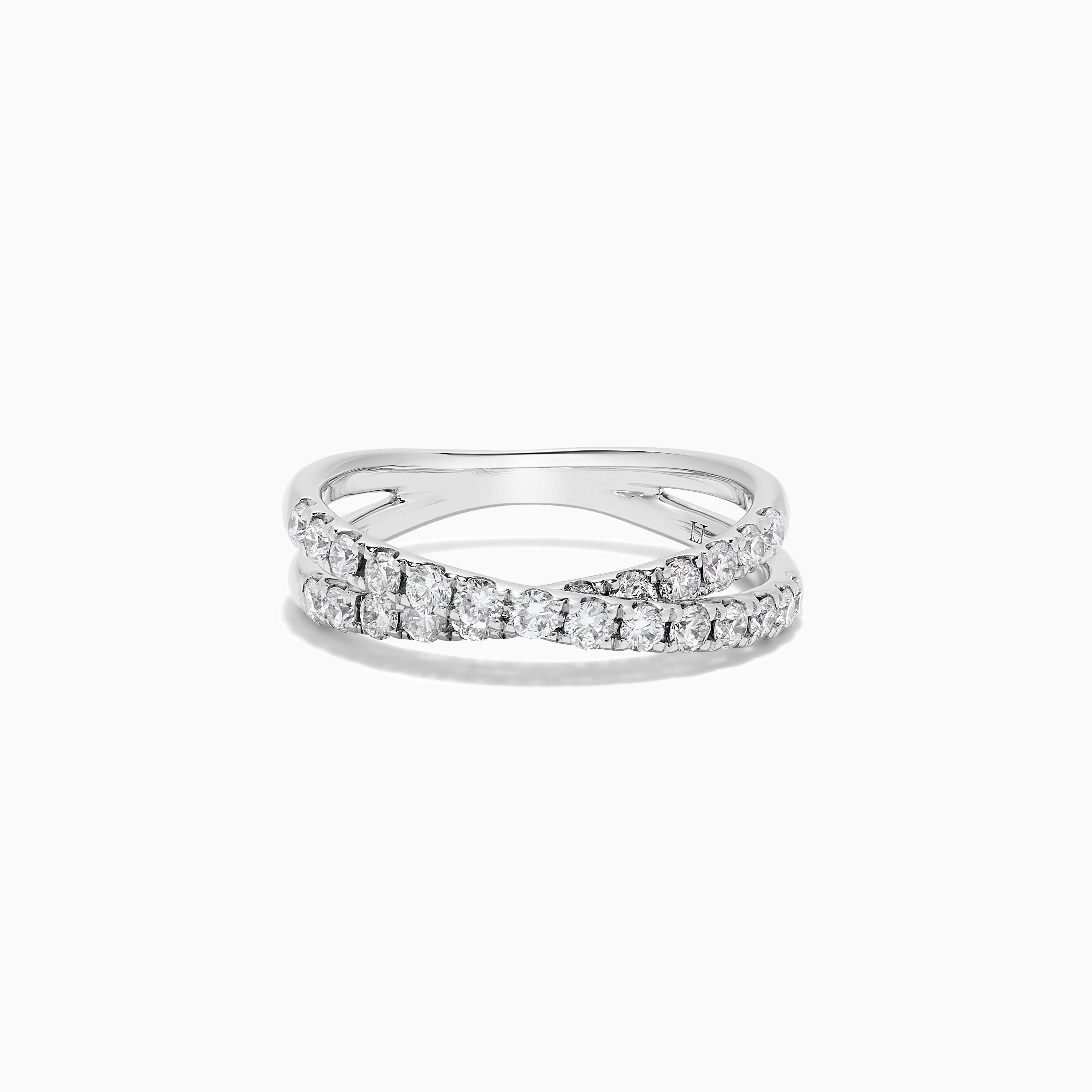 RareGemWorld's classic diamond band. Mounted in a beautiful 18K White Gold setting with natural round white diamond melee. This band is guaranteed to impress and enhance your personal collection!
Total Weight: .69cts
Length: 21.2 x 4.5 mm
Shank