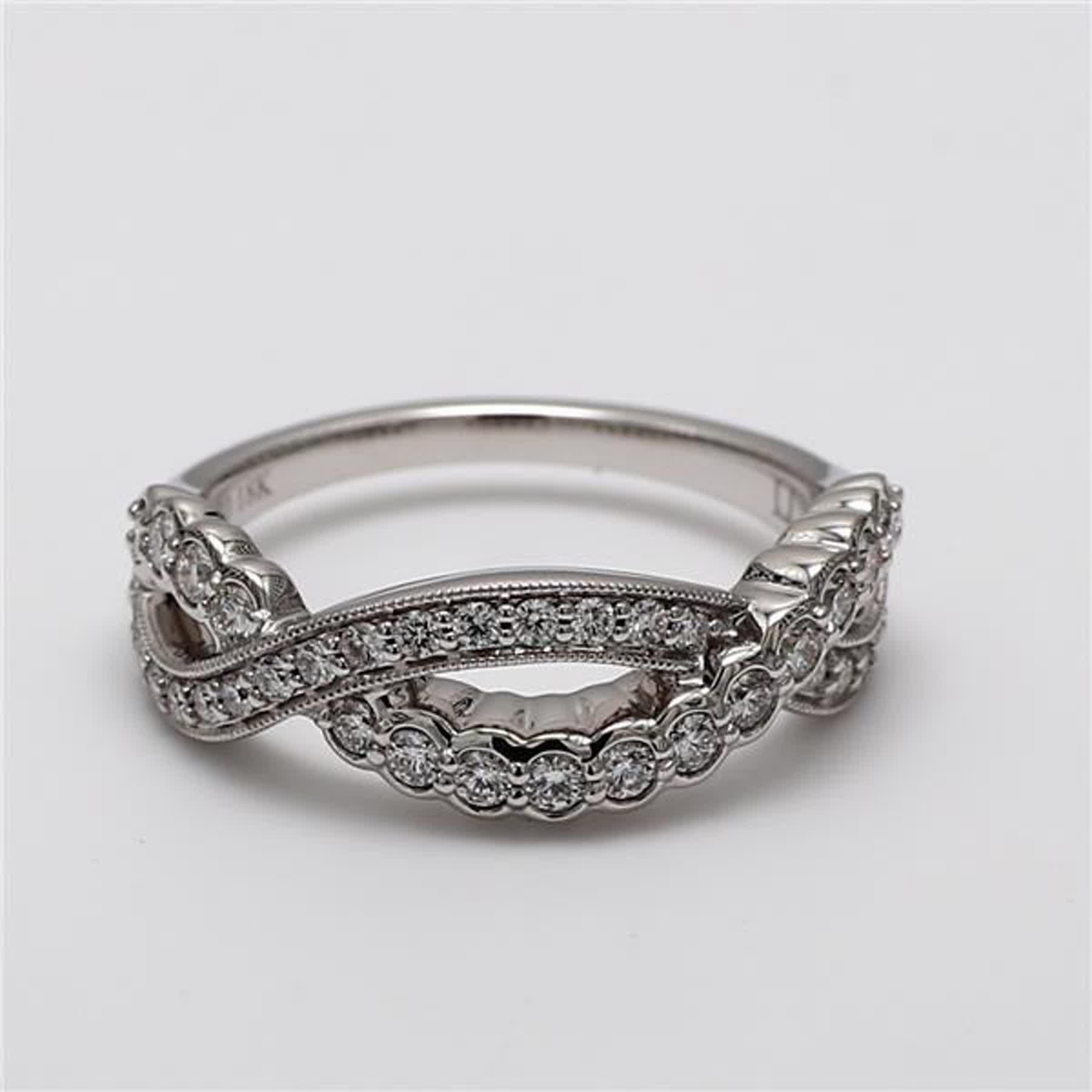 RareGemWorld's classic diamond band. Mounted in a beautiful 18K White Gold setting with natural round white diamond melee. This band is guaranteed to impress and enhance your personal collection!

Total Weight: .49cts

Length x Width: 21.4 x 7.01