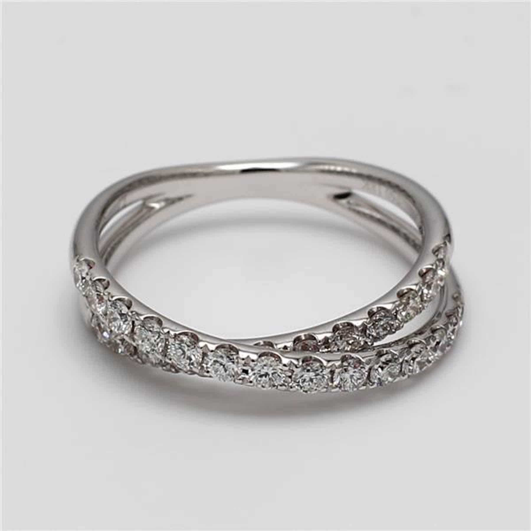 RareGemWorld's classic diamond band. Mounted in a beautiful 18K White Gold setting with natural round white diamond melee. This band is guaranteed to impress and enhance your personal collection!

Total Weight: .69cts

Length: 21.2 mm

Shank