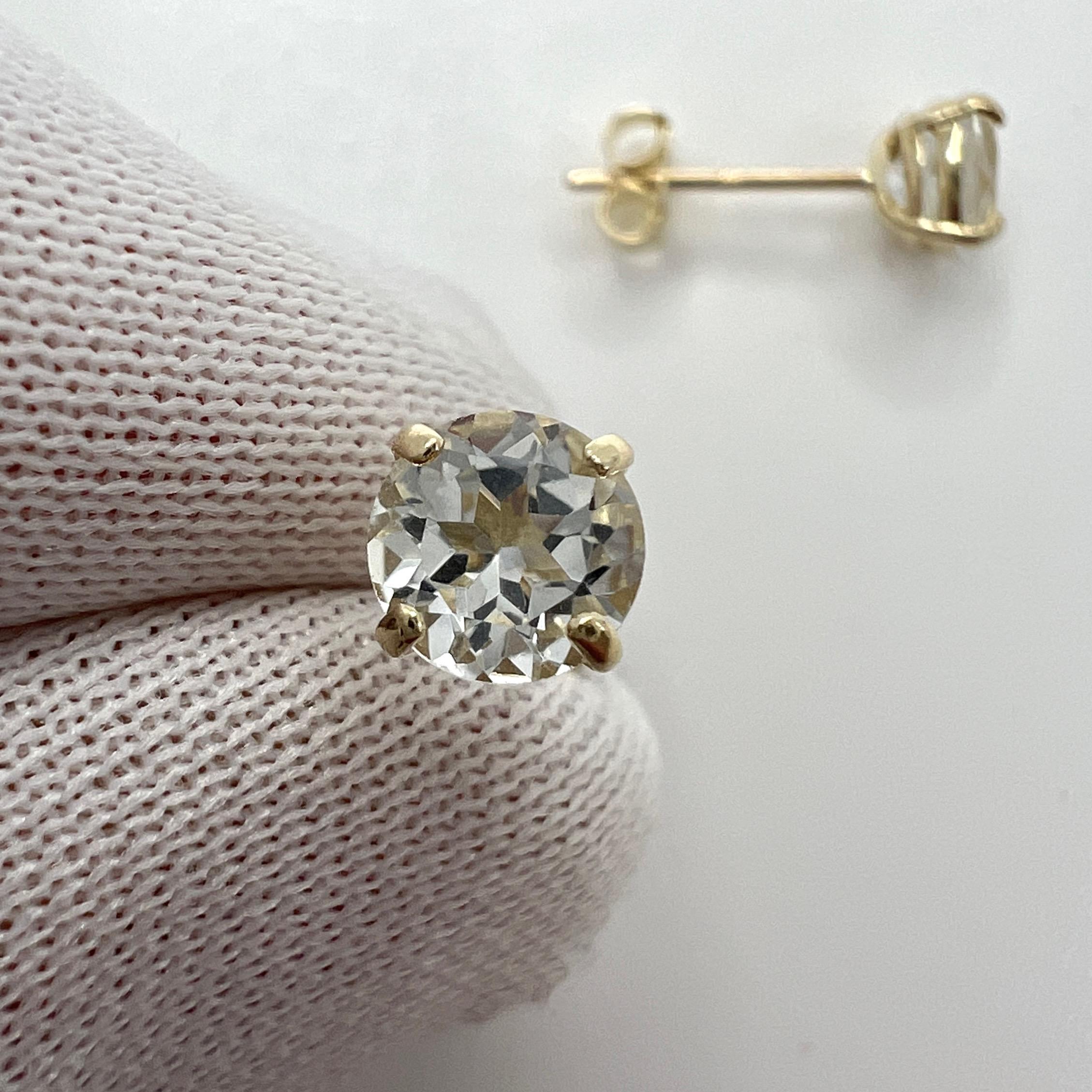 Natural White Topaz 5mm Round Cut 1.15ct 9K Yellow Gold Stud Earrings.

Beautiful 5mm matching pair of natural white topaz with excellent clarity and an excellent round brilliant cut. 

The gemstones may vary slightly from the images as these studs