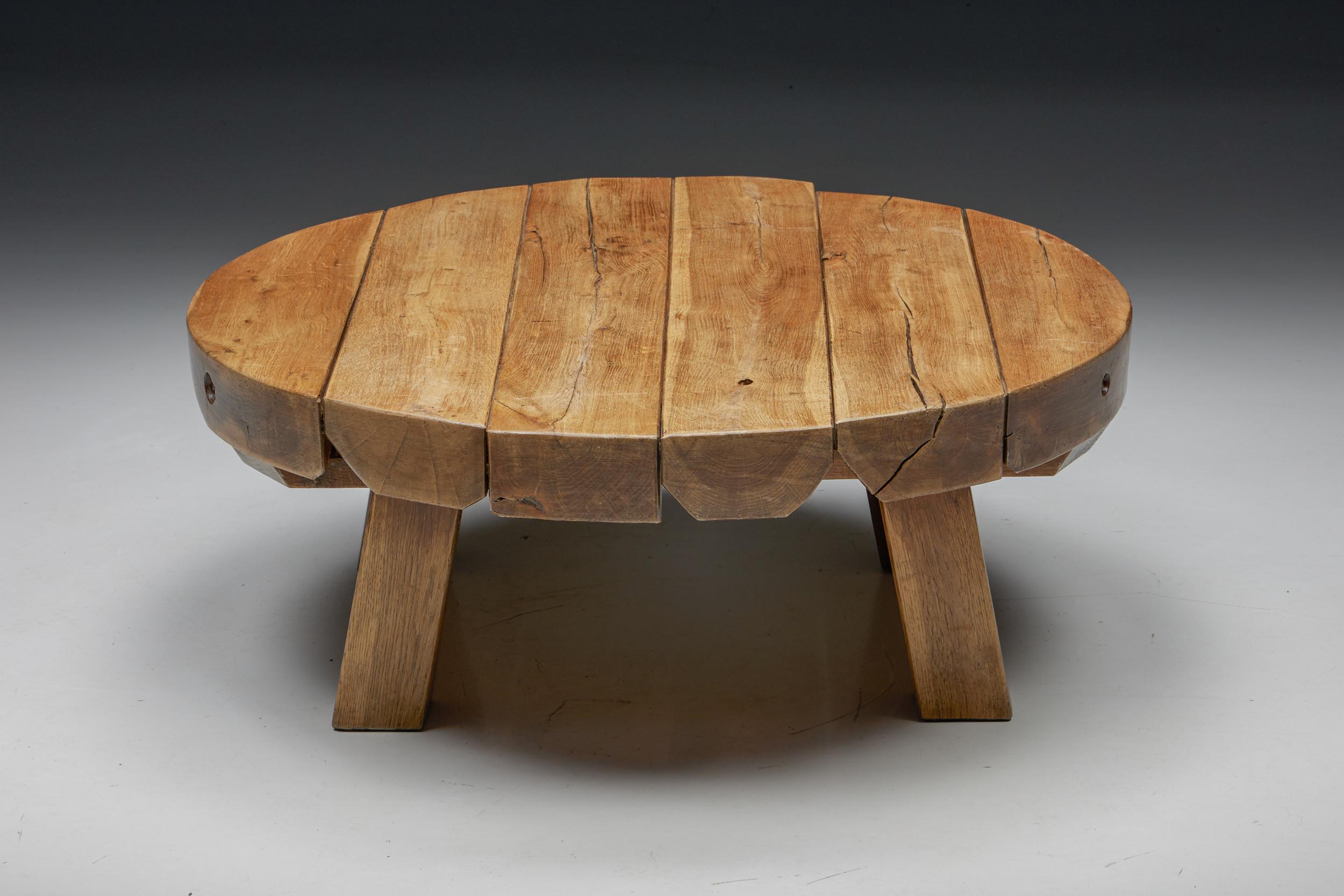 Rustic; Round; Rural; Robust; Wabi-Sabi; Wooden; Coffee Table; France; 1950s;

This rustic round coffee table with a four-legged base is made of wood with a very charismatic patina. The rounded surface provides space for objects like books,