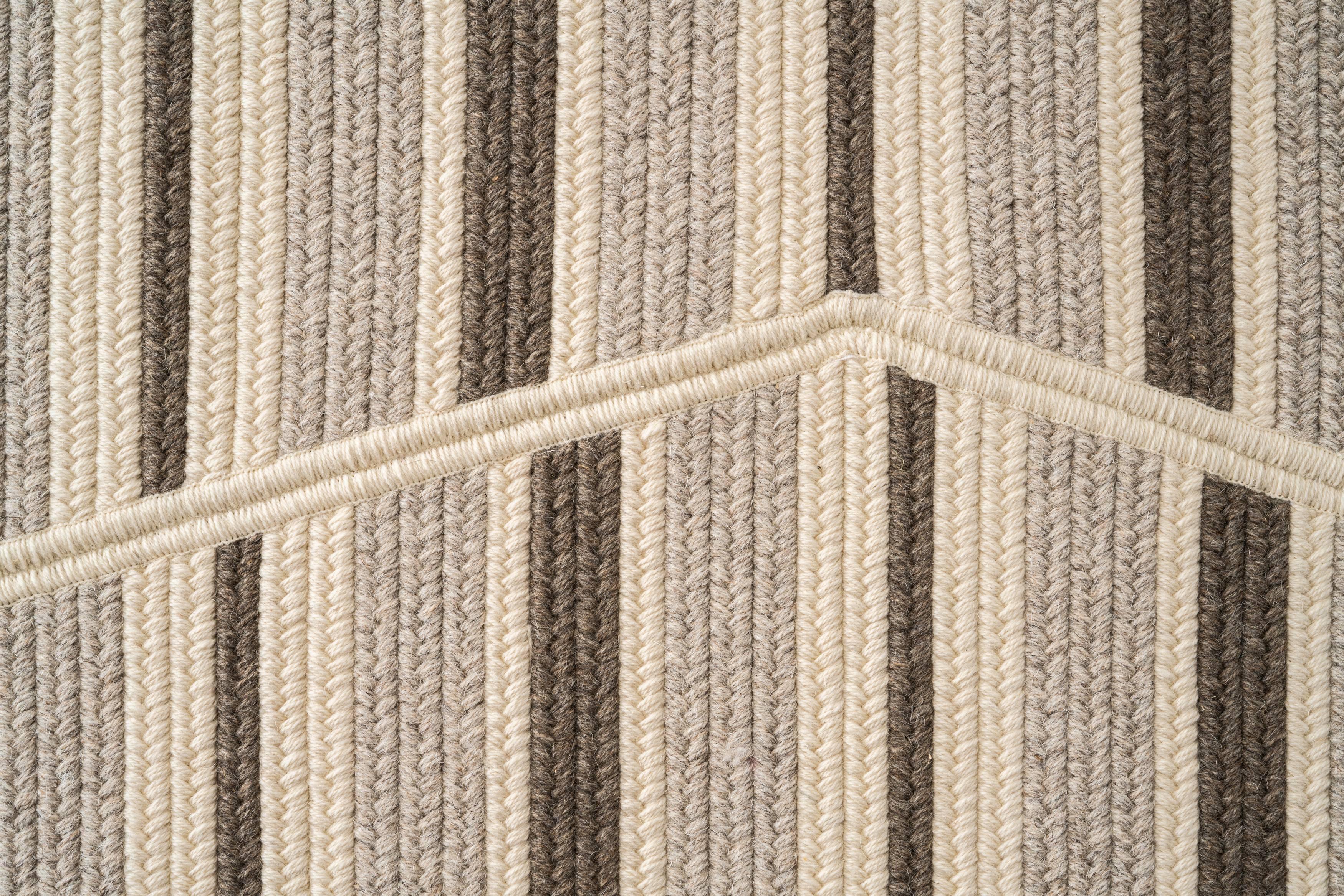 Sands natural wool 8'x10' rectangle reversible rug. Cream, light and dark grey yarns of natural un-dyed wool create stripes of flat woven braid that are broken up by shape and line.  Designed in the Thayer Design Studio (Best of Houzz Design 2018),