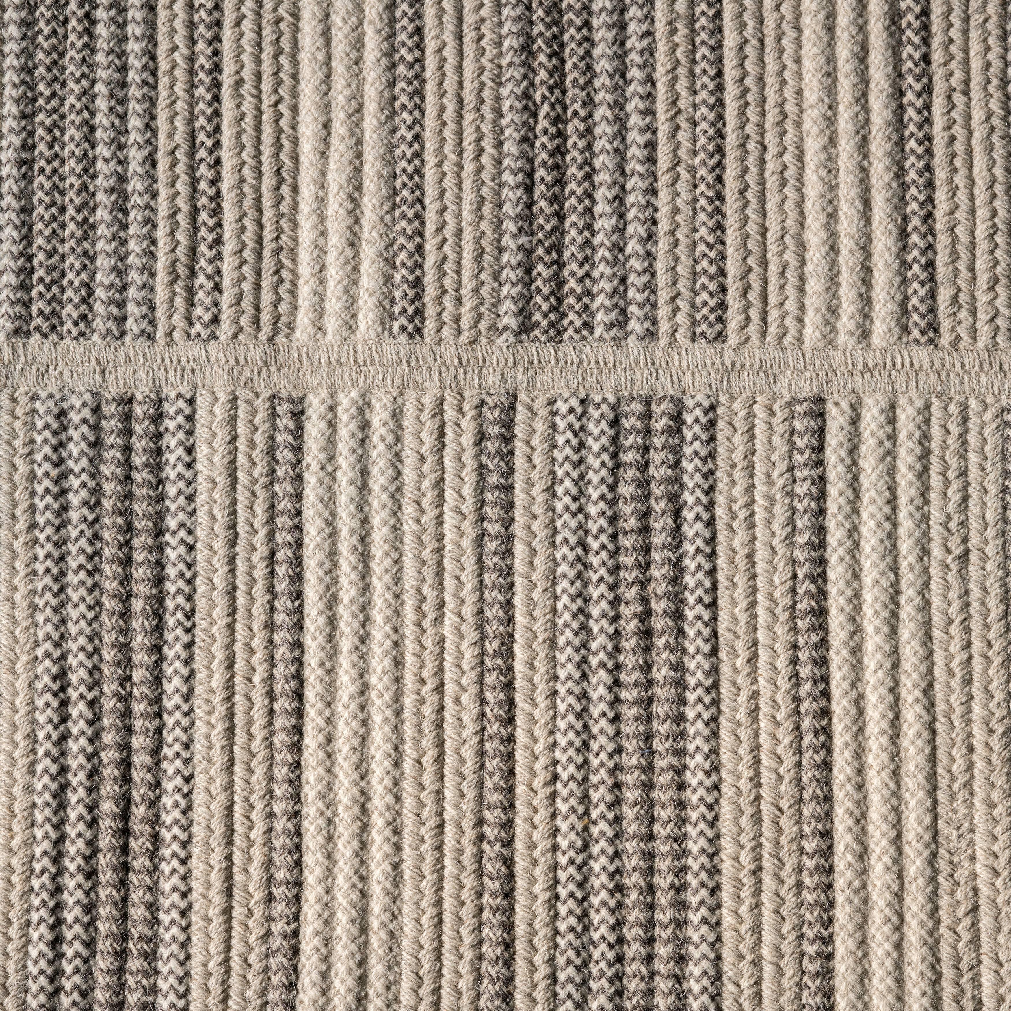 Path grey natural un-dyed wool stripe 8 x 10 Reversible rug. Natural un-dyed wools in light grey, dark grey, natural and cream are combined in various braid styles and techniques. Each band is cut and sewn to add pattern and texture.  Designed in