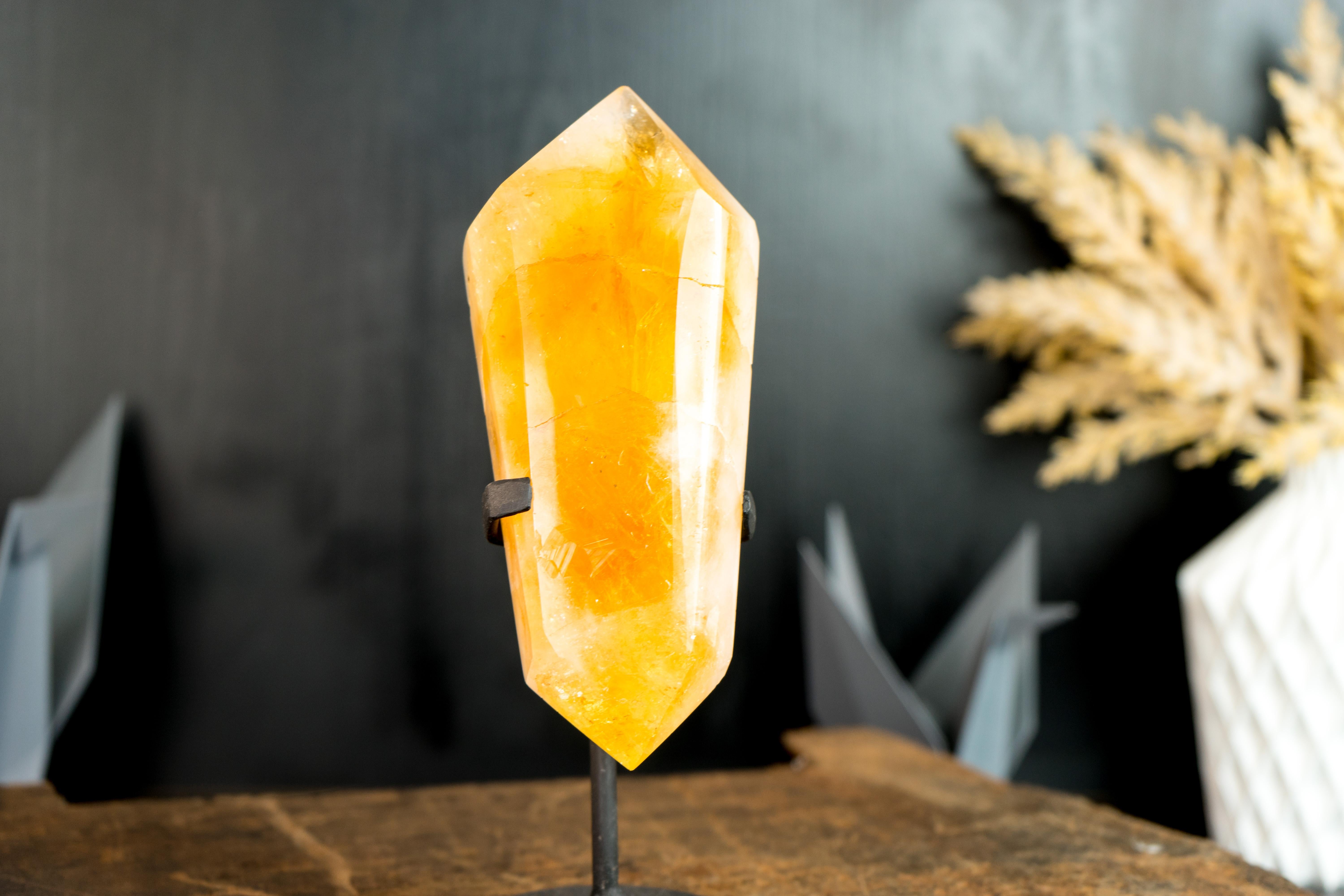 A gorgeous, large, bi-terminated Brazilian Citrine point that brings a candy-like, fabulous deep orange citrine color, which is characteristic of high-grade citrines. This is formed in an XL-size specimen, rarely seen in Citrines from South Brazil.