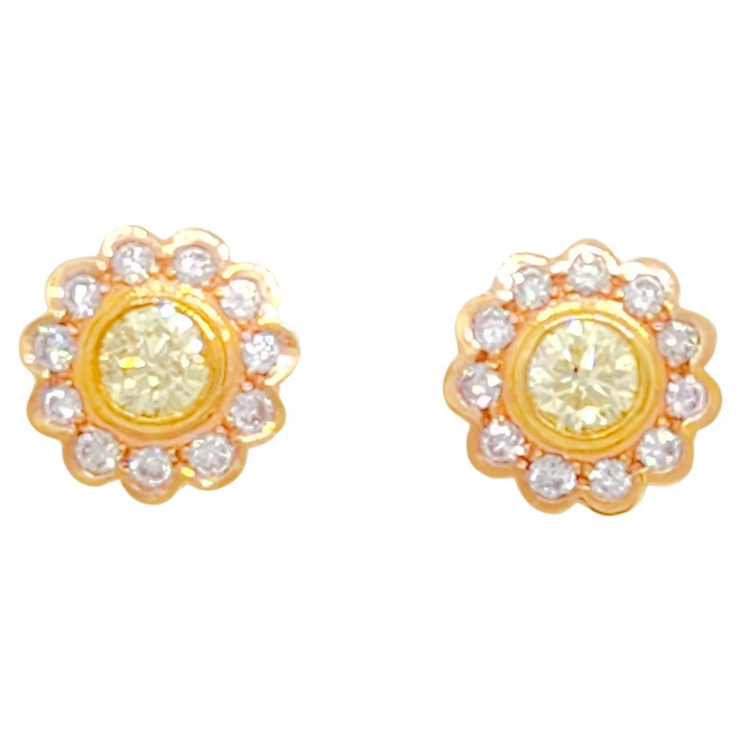 Beautiful 0.98 ct. bright yellow diamond rounds with 0.70 ct. good quality pink diamond rounds.  Handmade in a floral design and in 18k white and rose gold.  Push back setting.