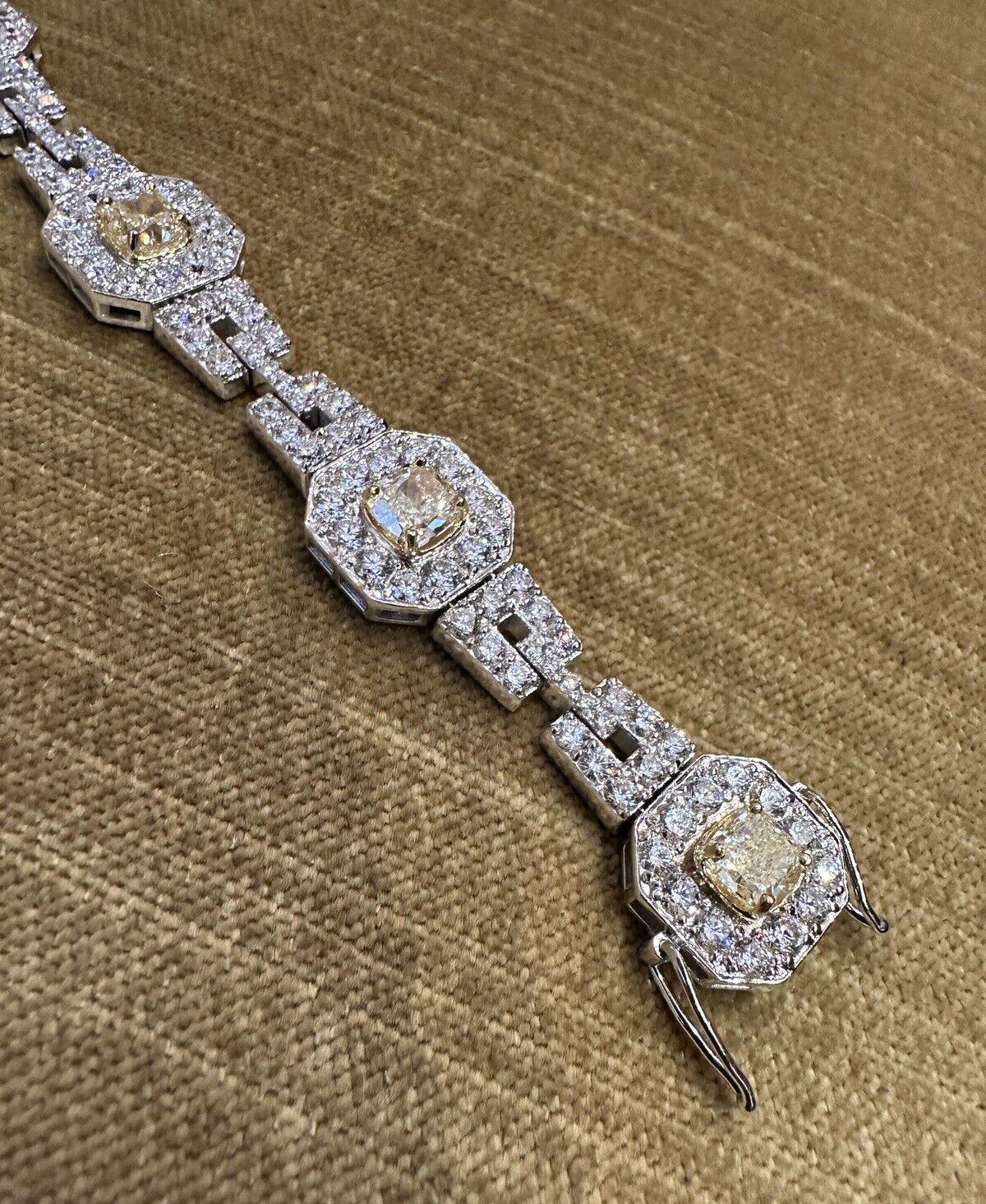 Natural Yellow and White Diamond Bracelet in 18k White Gold 

Diamond Link Bracelet features 6 Natural Cushion-cut Yellow Diamonds set in the center of each link, surrounded by White Round Brilliant Diamonds, and with Round Brilliant Diamonds on the