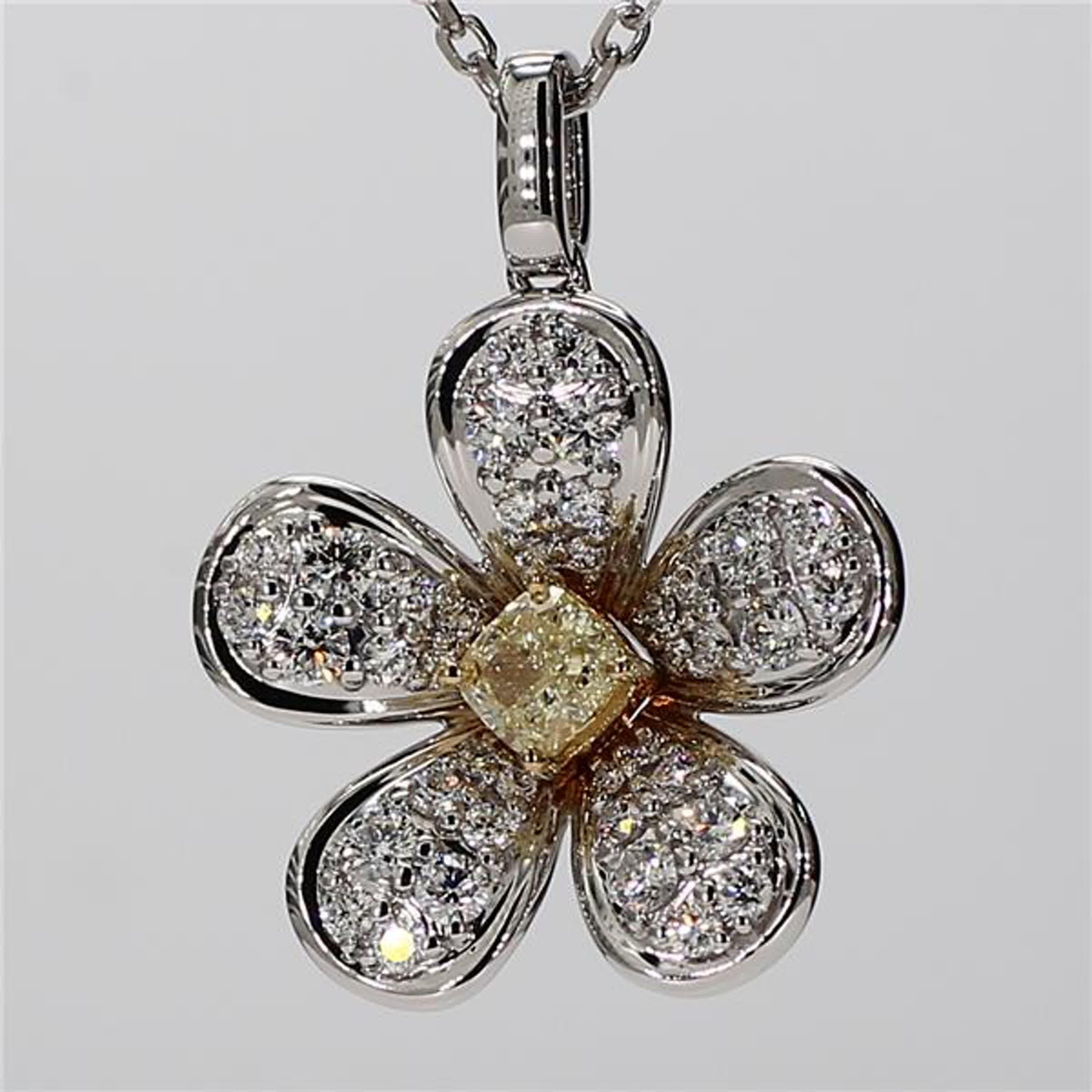 RareGemWorld's intriguing diamond pendant. Mounted in a beautiful 18K Yellow and White Gold setting with a natural cushion cut yellow diamond. The yellow diamond is surrounded by small round natural white diamond melee in a beautiful flower shape.